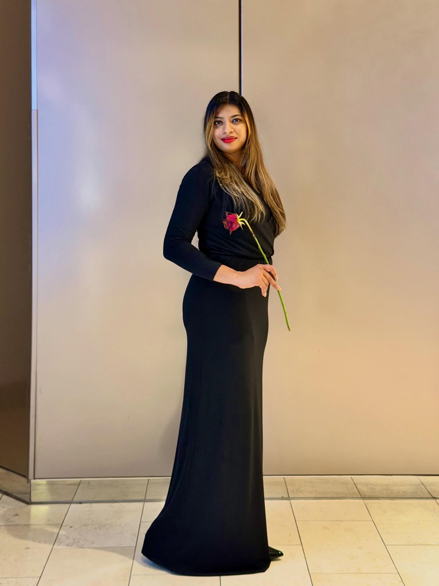 27 Spooktacular Halloween Outfits You Need for 2026 9 Elegant Black Maxi Dress With Red Rose Accent