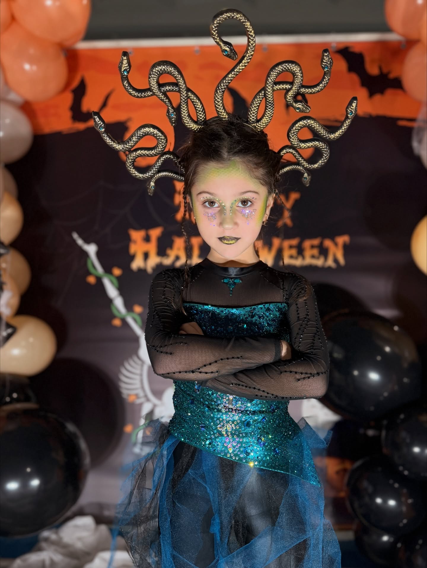 27 Spooktacular Halloween Hairstyles for Kids 2026 19 Enchanting Medusa Halloween Costume In Black & Teal