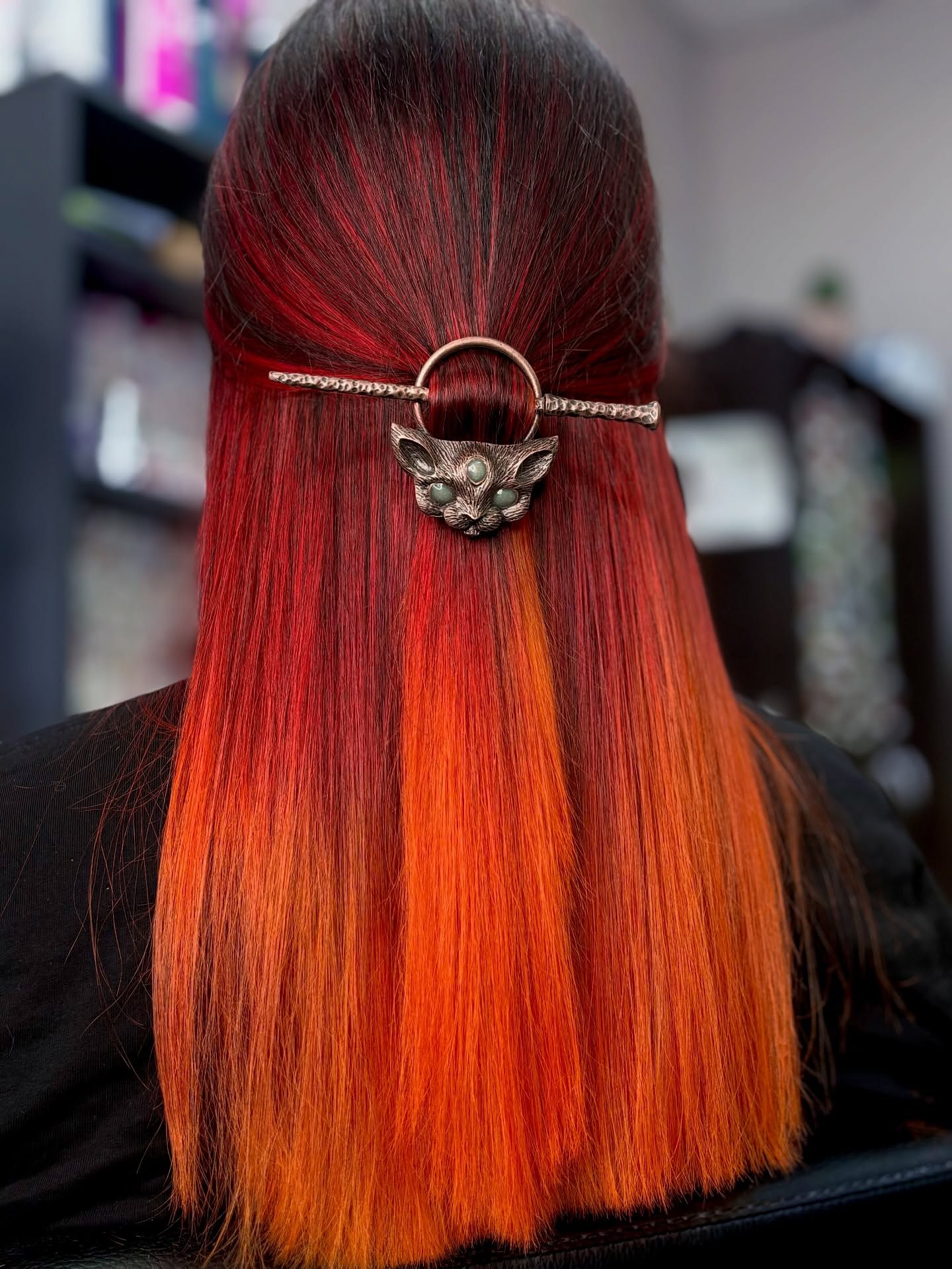 27 Red Hair Color Trends You Need for 2026 9 Fiery Ombre With Cute Cat Hair Accessory
