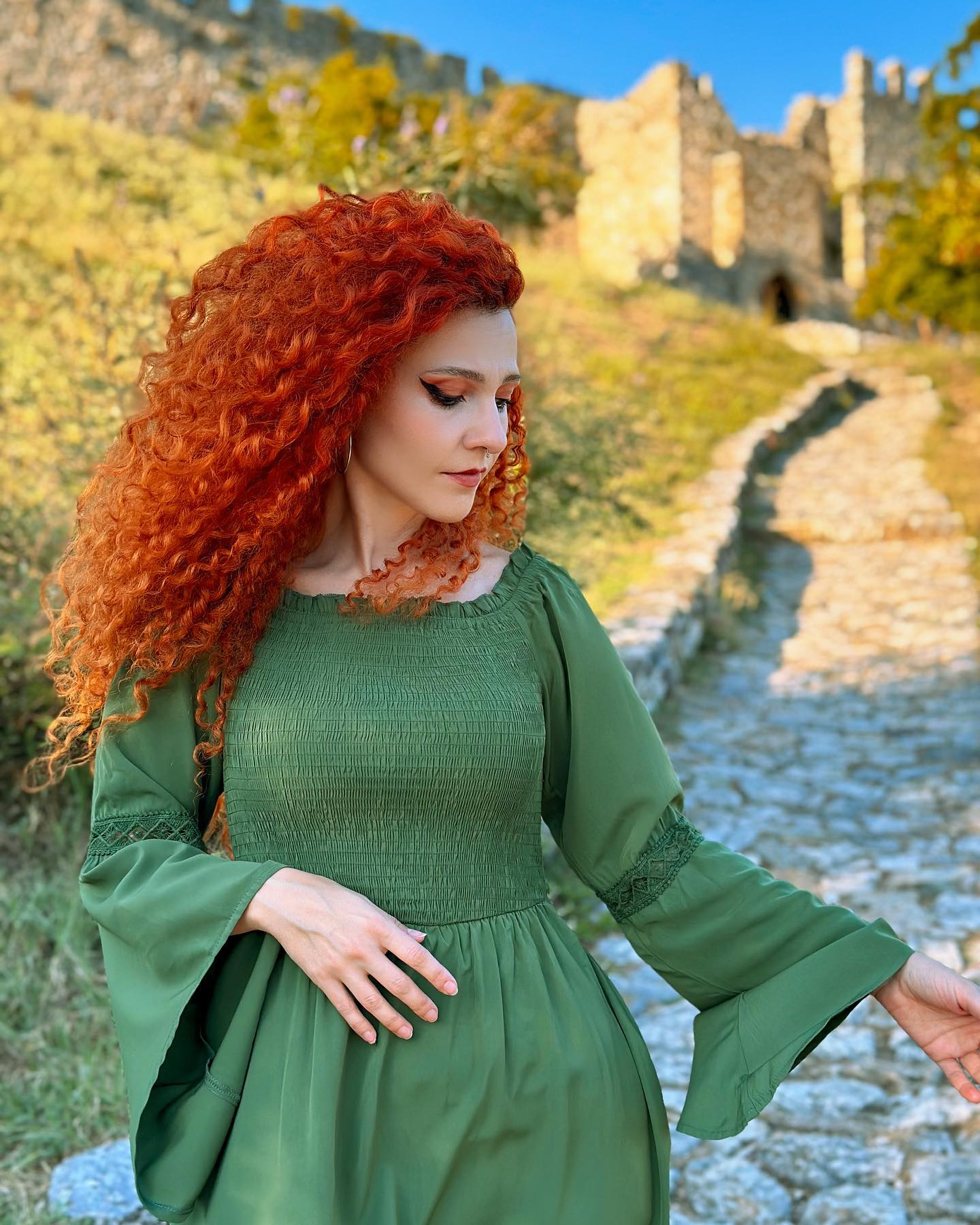 25 Witch Hairstyles 2026: Enchant Your Look 11 Fiery Red Voluminous Curls Witchy Vibes
