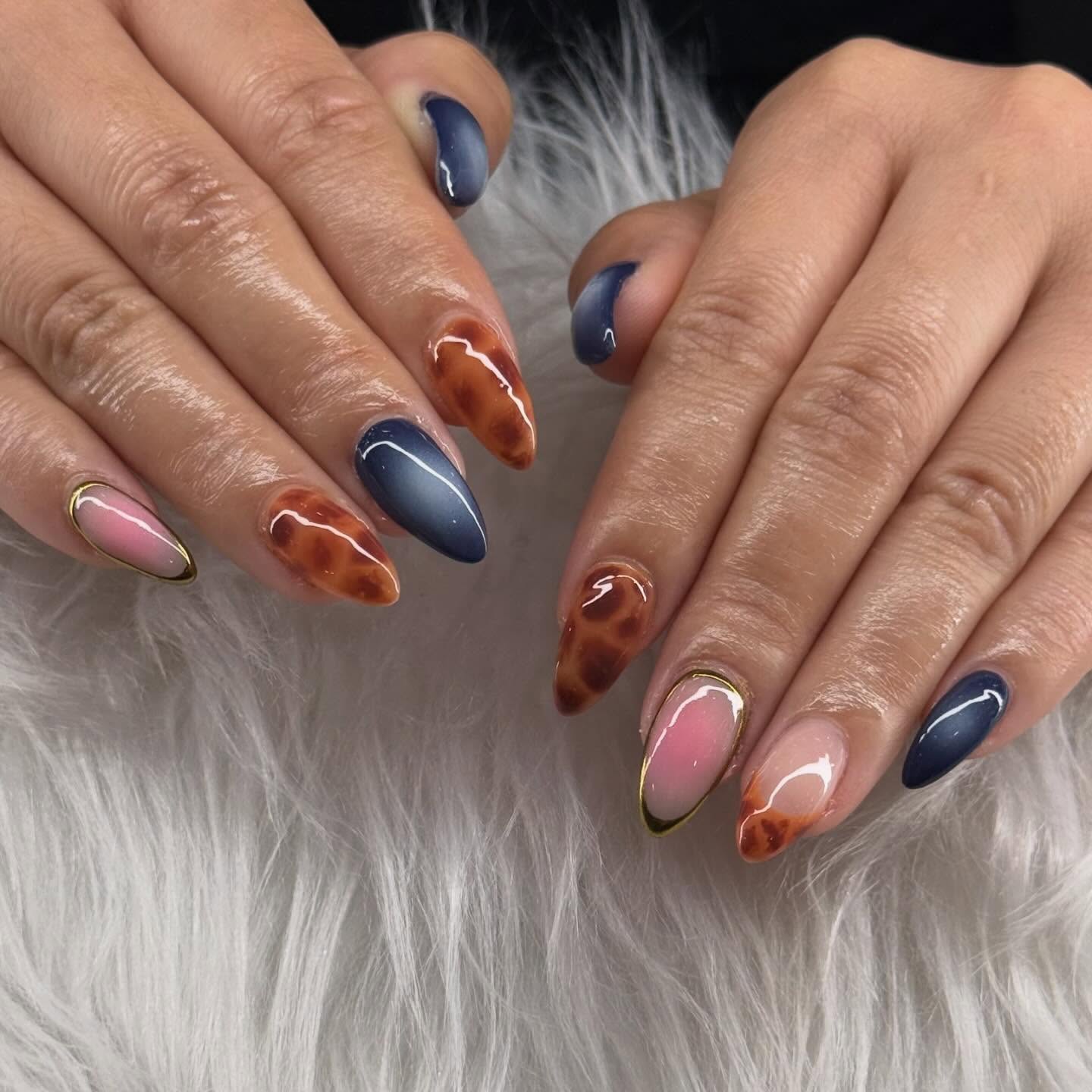 25 Fall Nail Ideas You Need to Try in 2026 13 Glossy Tortoiseshell & Navy Almond Nails