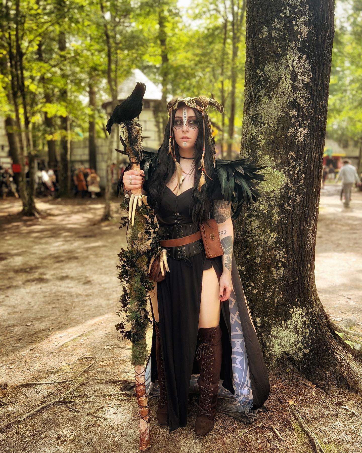 25 Witchy Outfit Ideas for 2026 5 Gothic Black Maxi Dress With Lace-Up Boots