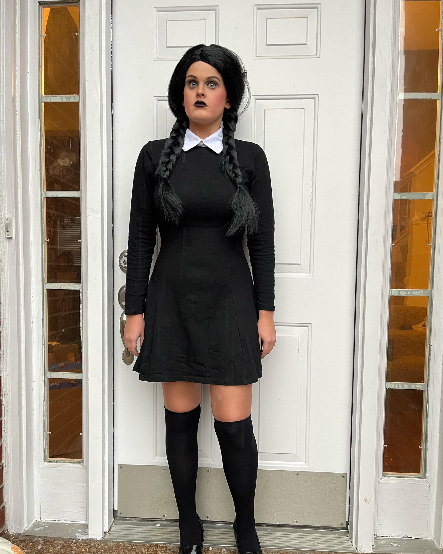 27 Spooktacular Halloween Outfits You Need for 2026 23 Gothic Doll Wednesday Addams Halloween Costume