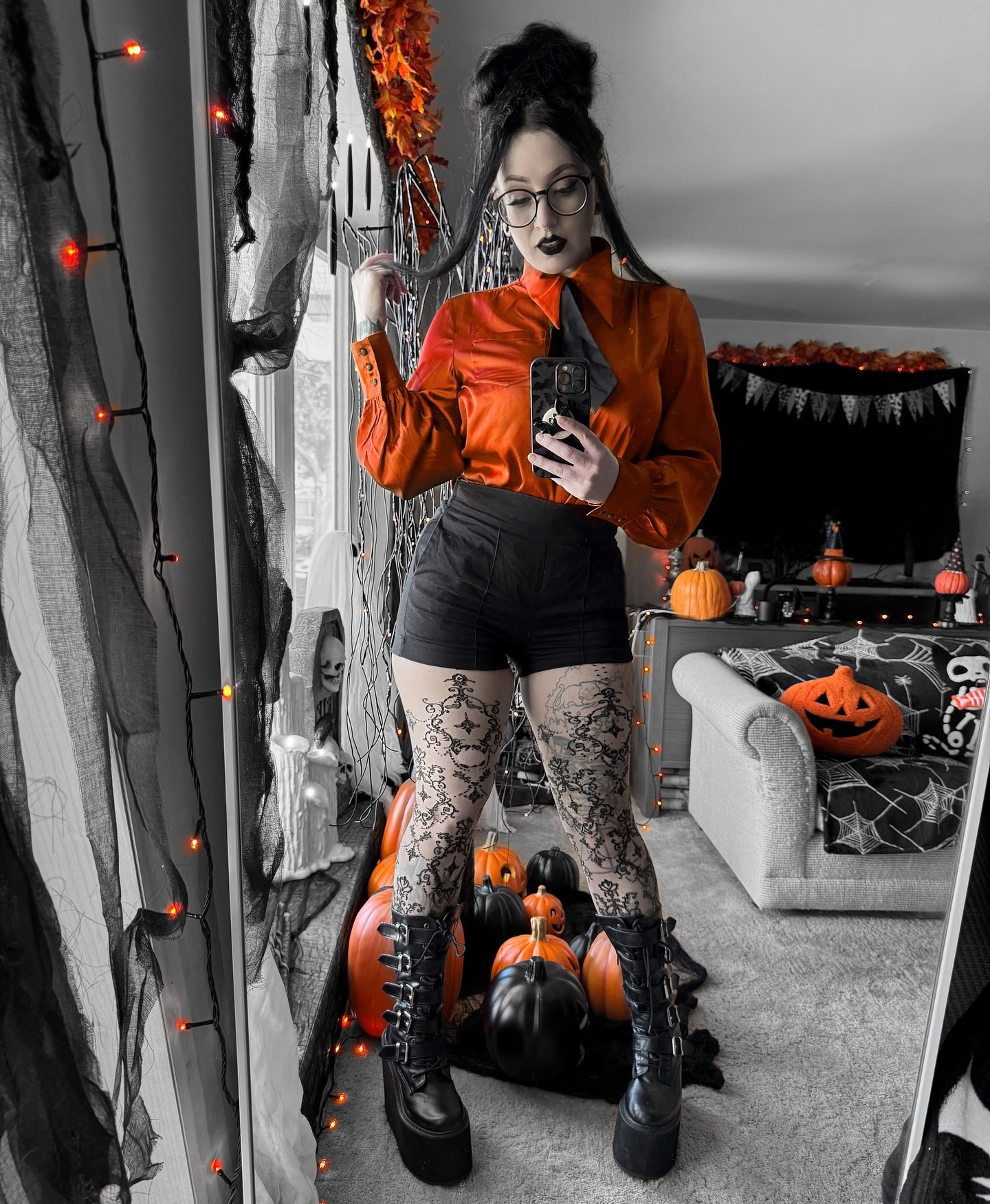 27 Spooktacular Halloween Outfits You Need for 2026 21 Gothic Glamour Orange Blouse & Black Shorts Halloween