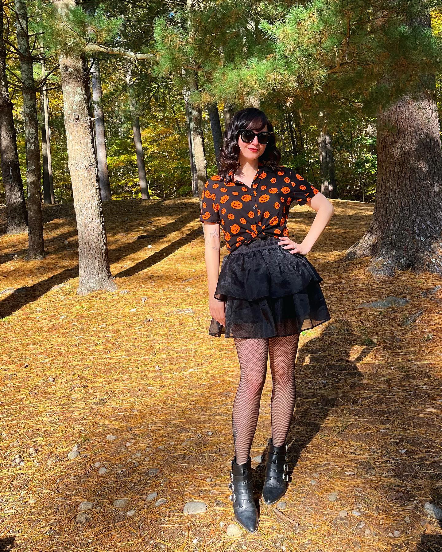 25 Fall Birthday Outfit Ideas You Need for 2026 16 Halloween Pumpkin Print Top With Black Ruffled Skirt