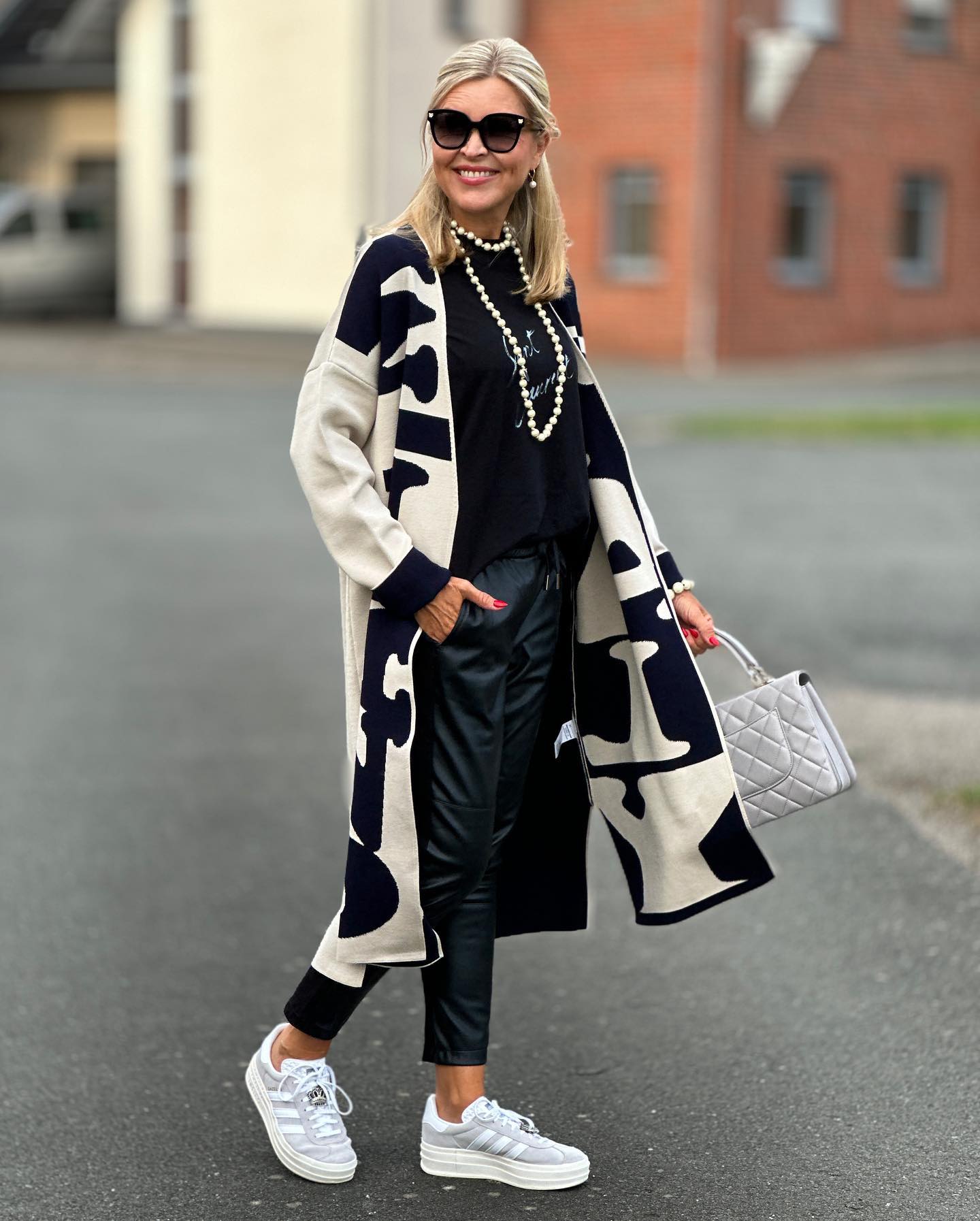 27 Cardigan Outfit Ideas You Need for 2026 7 Monogram Maxi Cardigan With Leather Pants And Sneakers