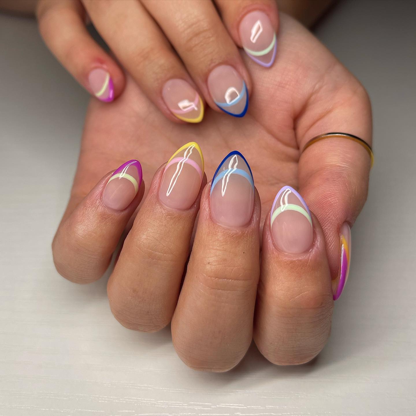 27 End of Summer Nail Ideas for 2026 11 Pastel Wavy French Tip Almond Nails