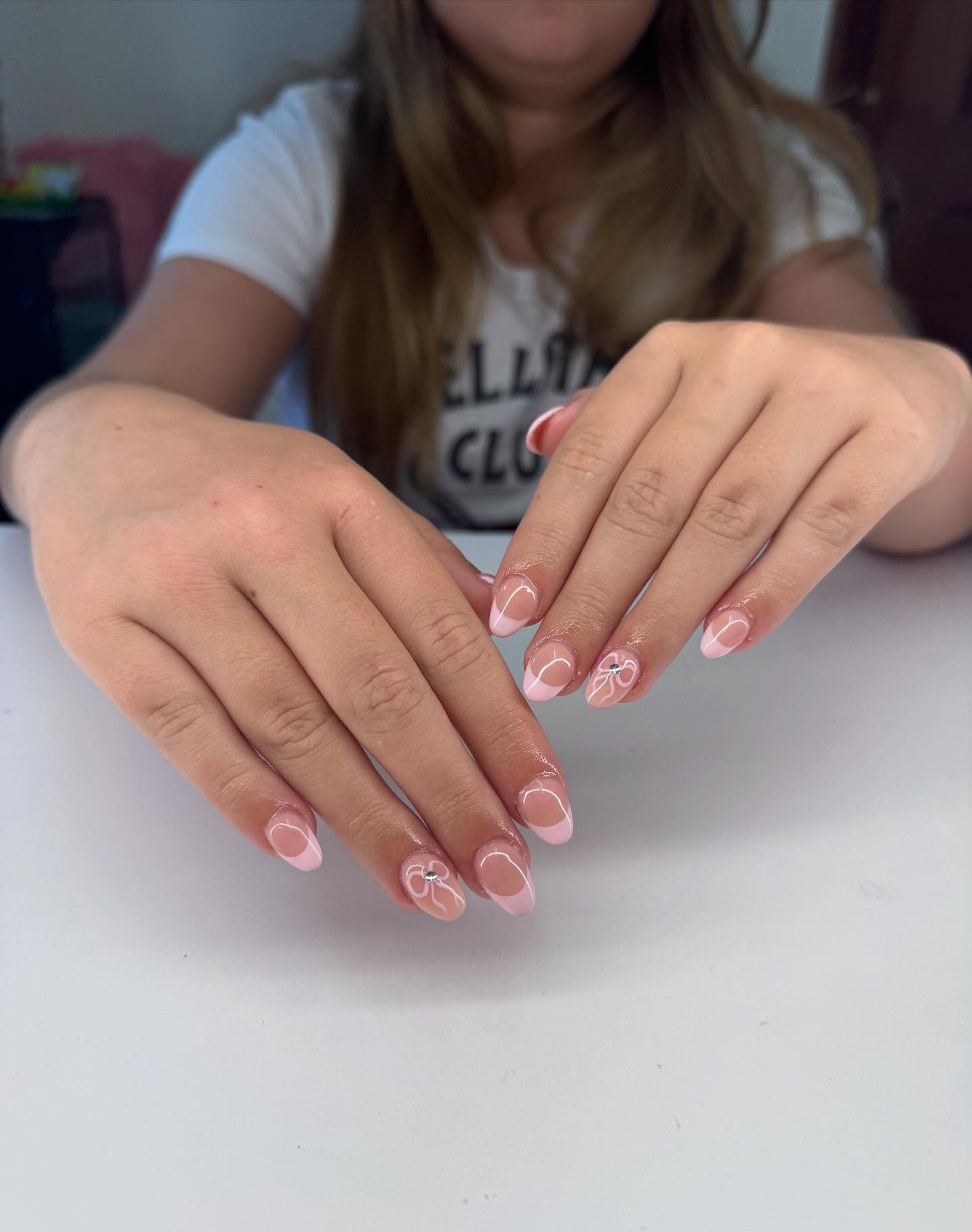 27 Back to School Nail Ideas for Teens 2026 9 Pink French Tips With Bow Accent Nails