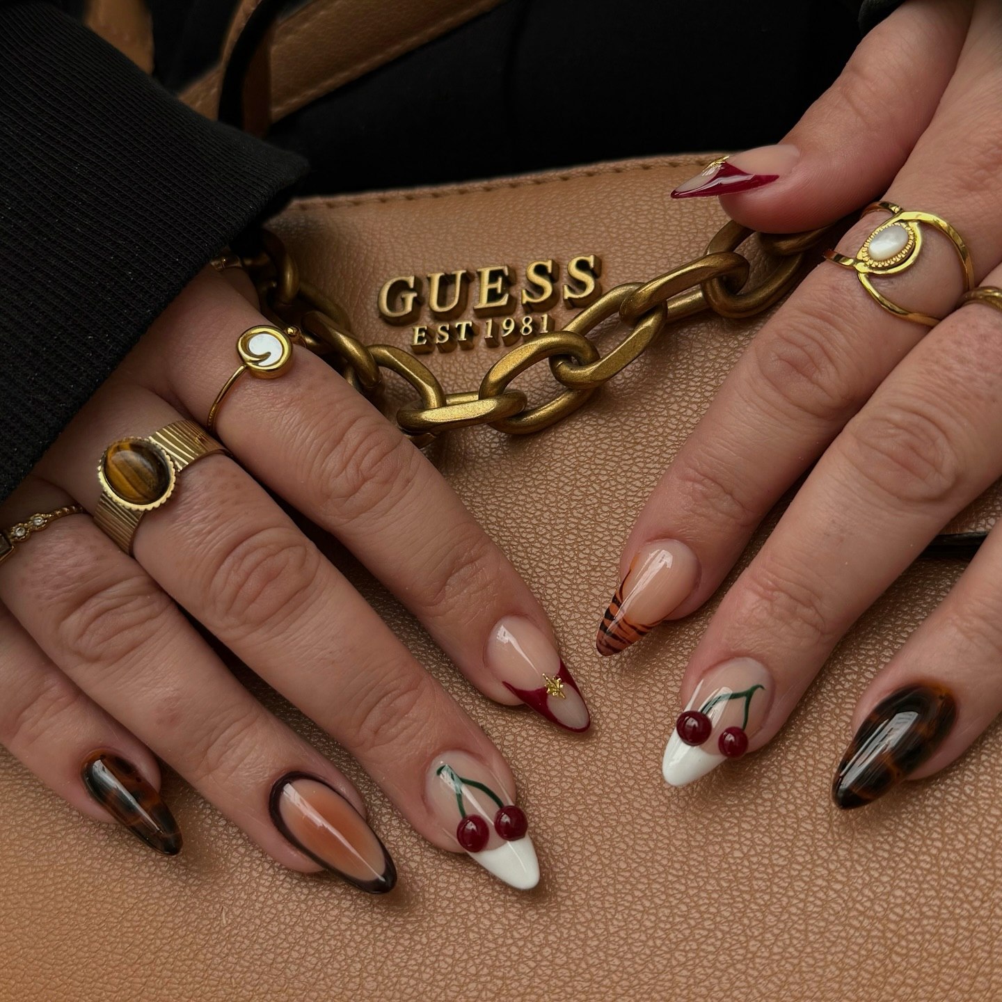 Playful Cherry French Tips With Tortoiseshell Accents
