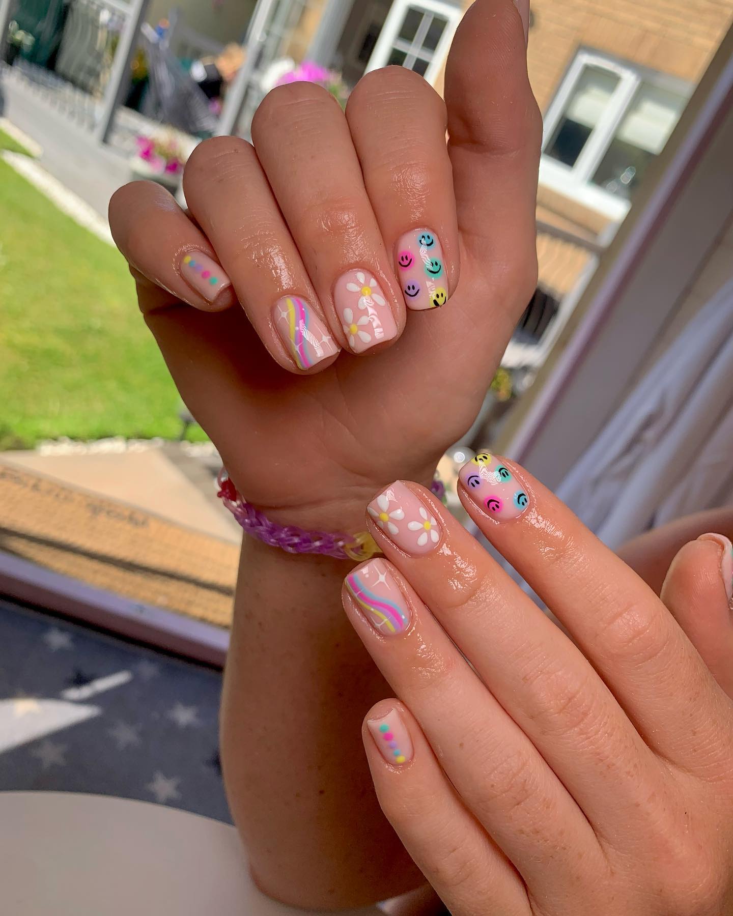 25 Back to School Nail Ideas for 2026 14 Playful Pastel Smiley Face & Daisy Nails
