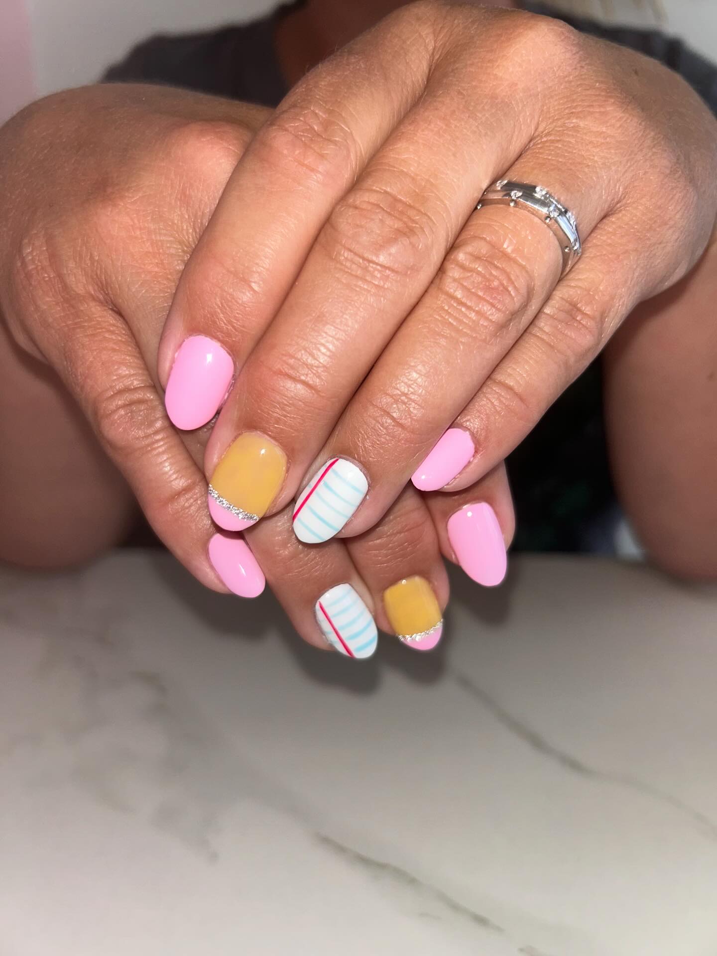 25 Back to School Nail Ideas for 2026 21 Playful Pink and Yellow Striped Nails