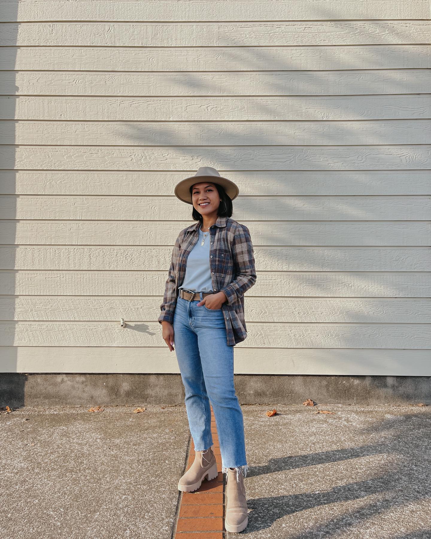 30 Transitional Fall Outfits You Need Now 8 Relaxed Plaid Flannel Layered Over Light Blue Tee and Jeans