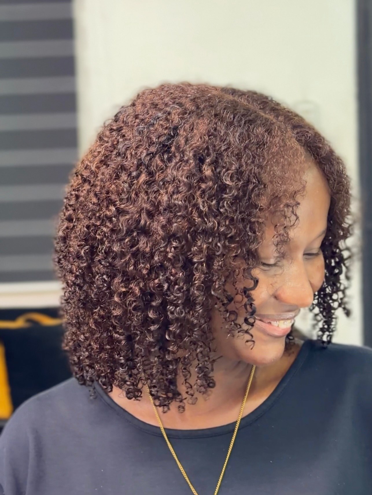 Rich Auburn Curly Lob With Defined Coils