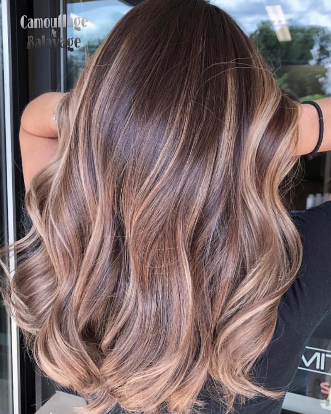 25 Stunning Fall Hair Colors for Brown Hair in 2026 12 Rich Bronze Balayage With Soft Waves