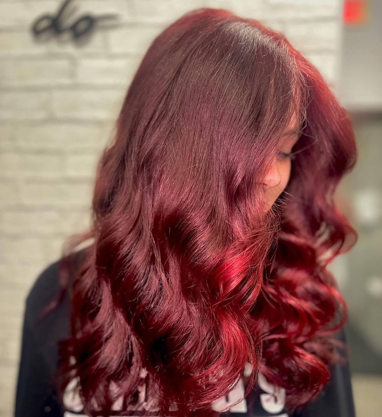 27 Stunning Fall Hair Colors for Brunettes 2026 24 Rich Crimson Red Hair With Loose Waves