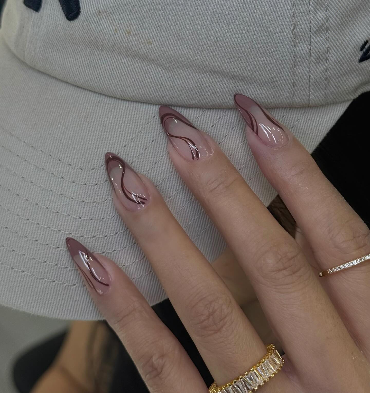 27 Chic Neutral Fall Nail Ideas You Need for 2026 13 Sheer Nude Swirl Almond Nails