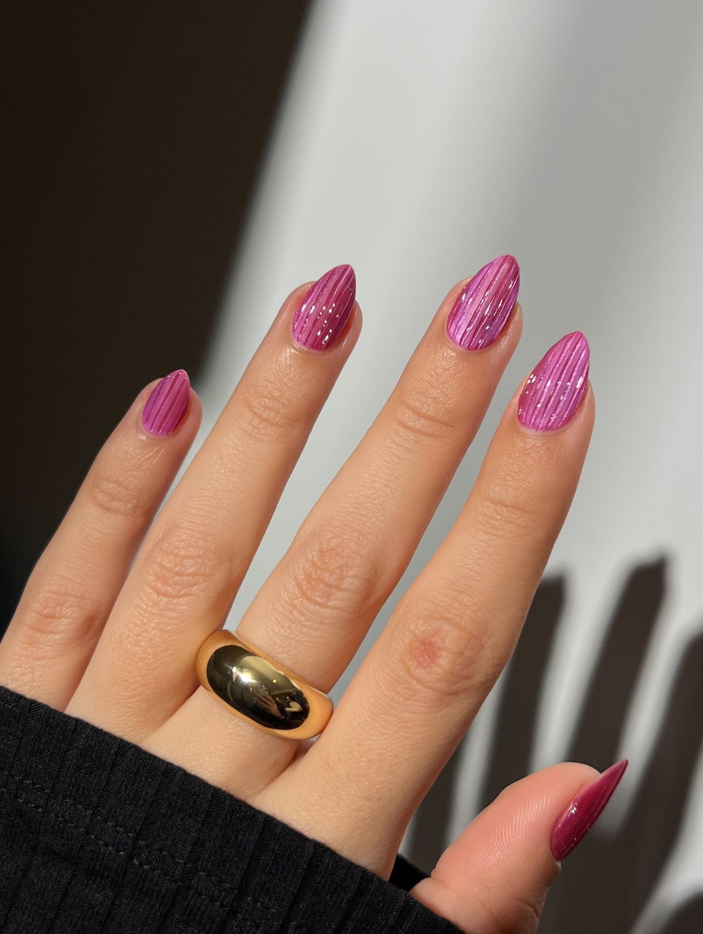 Shimmering Pink Ribbed Almond Nails
