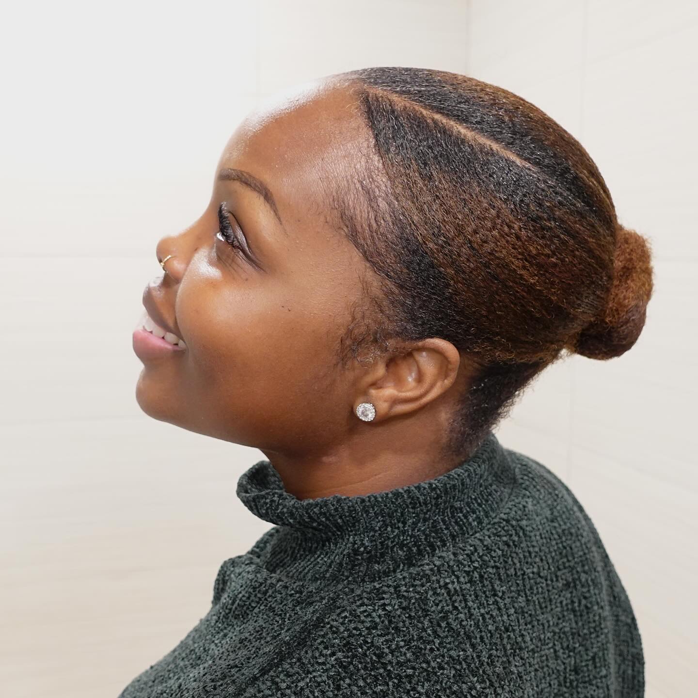 25 Stunning Type 4c Hairstyles You’ll See Everywhere in 2026 9 Sleek Low Bun With Defined Side Part
