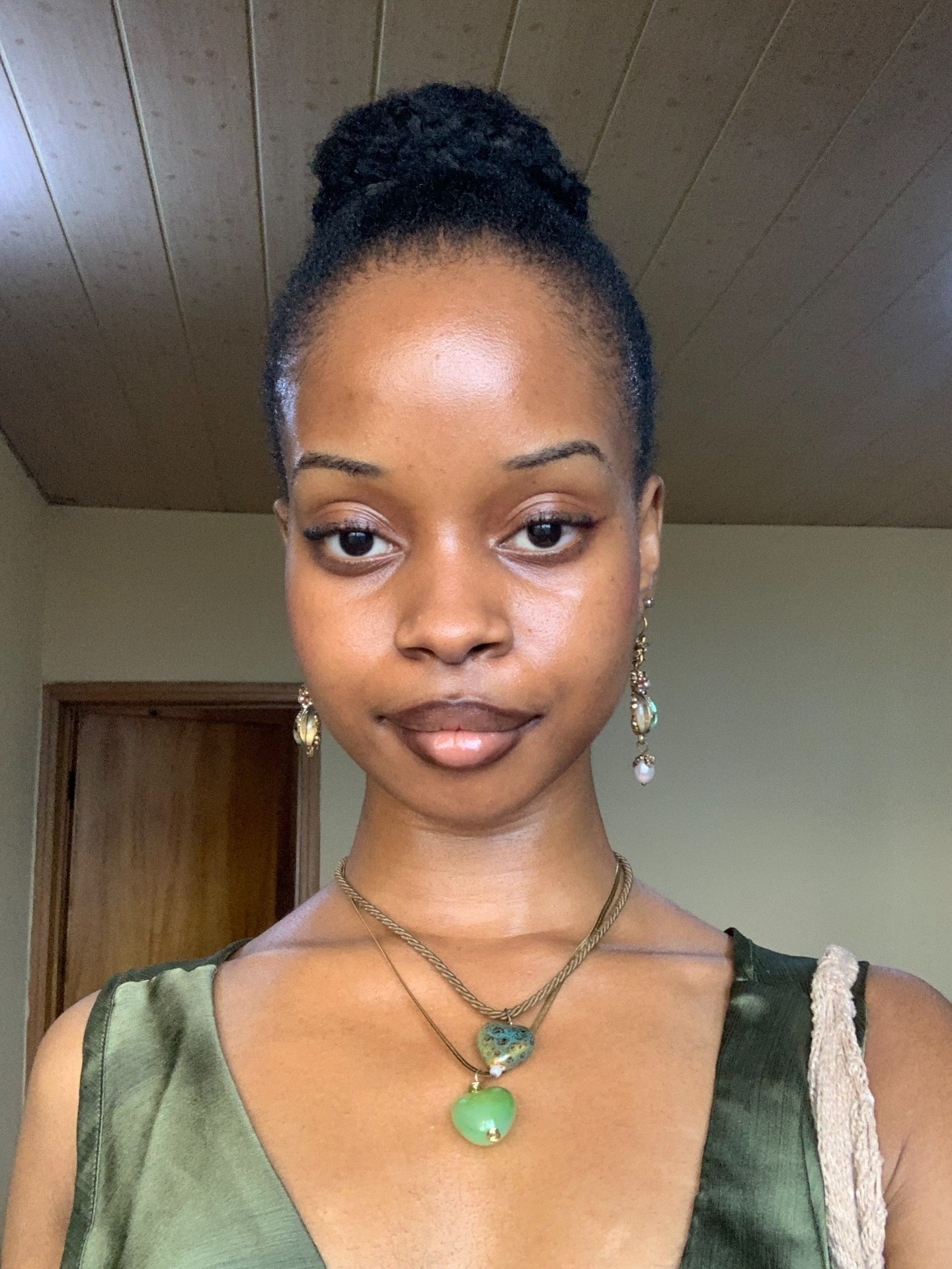 25 Stunning Type 4c Hairstyles You’ll See Everywhere in 2026 19 Sleek Top Knot With Defined Coils