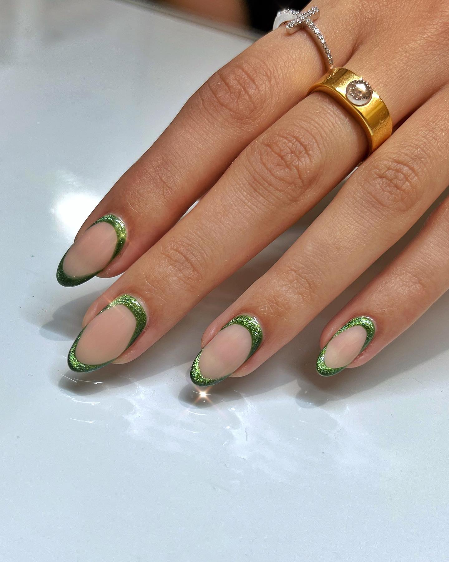 Sparkling Emerald French Tip Oval Nails