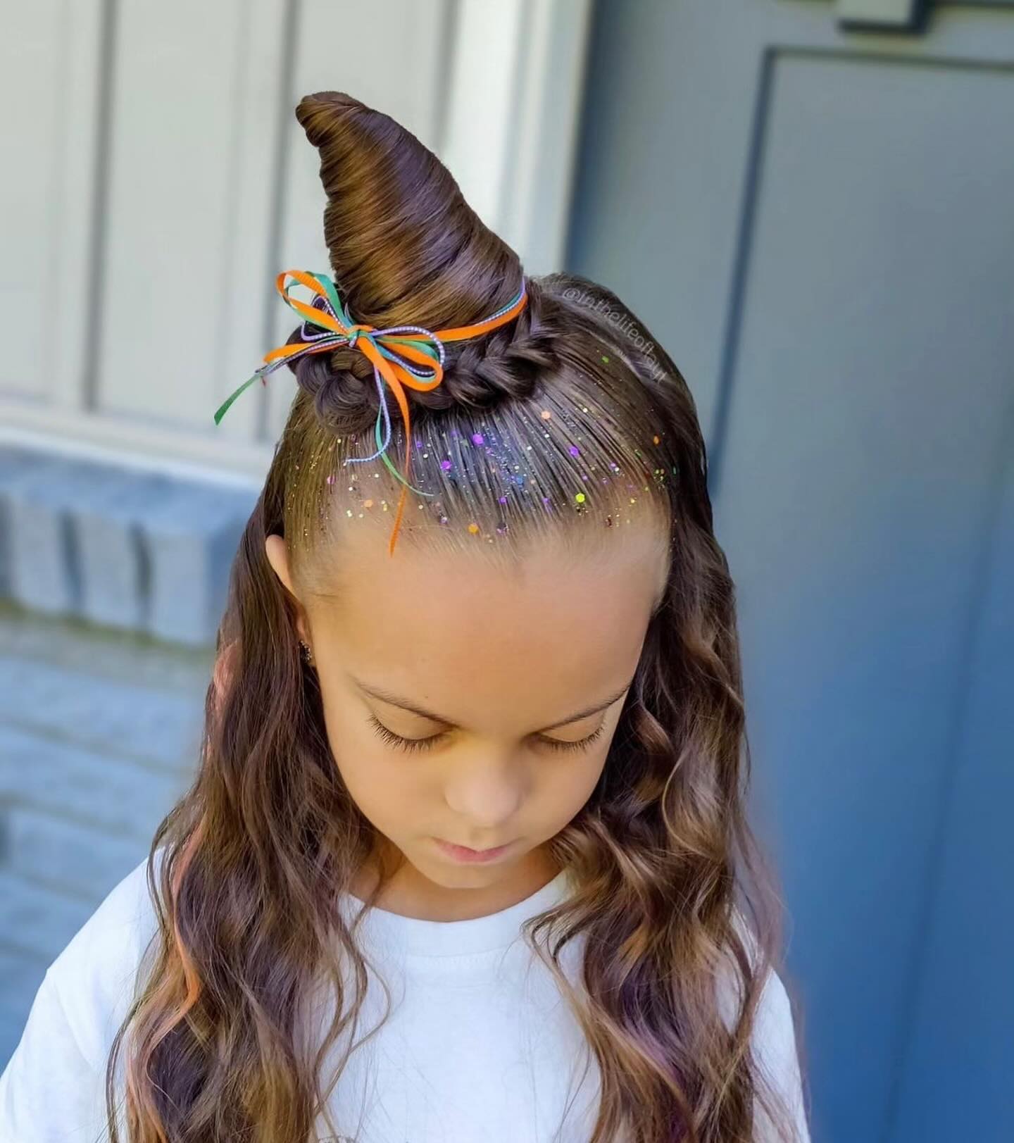 27 Spooktacular Halloween Hairstyles for Kids 2026 7 Sparkly Witch Hat With Twisty Bun And Braids