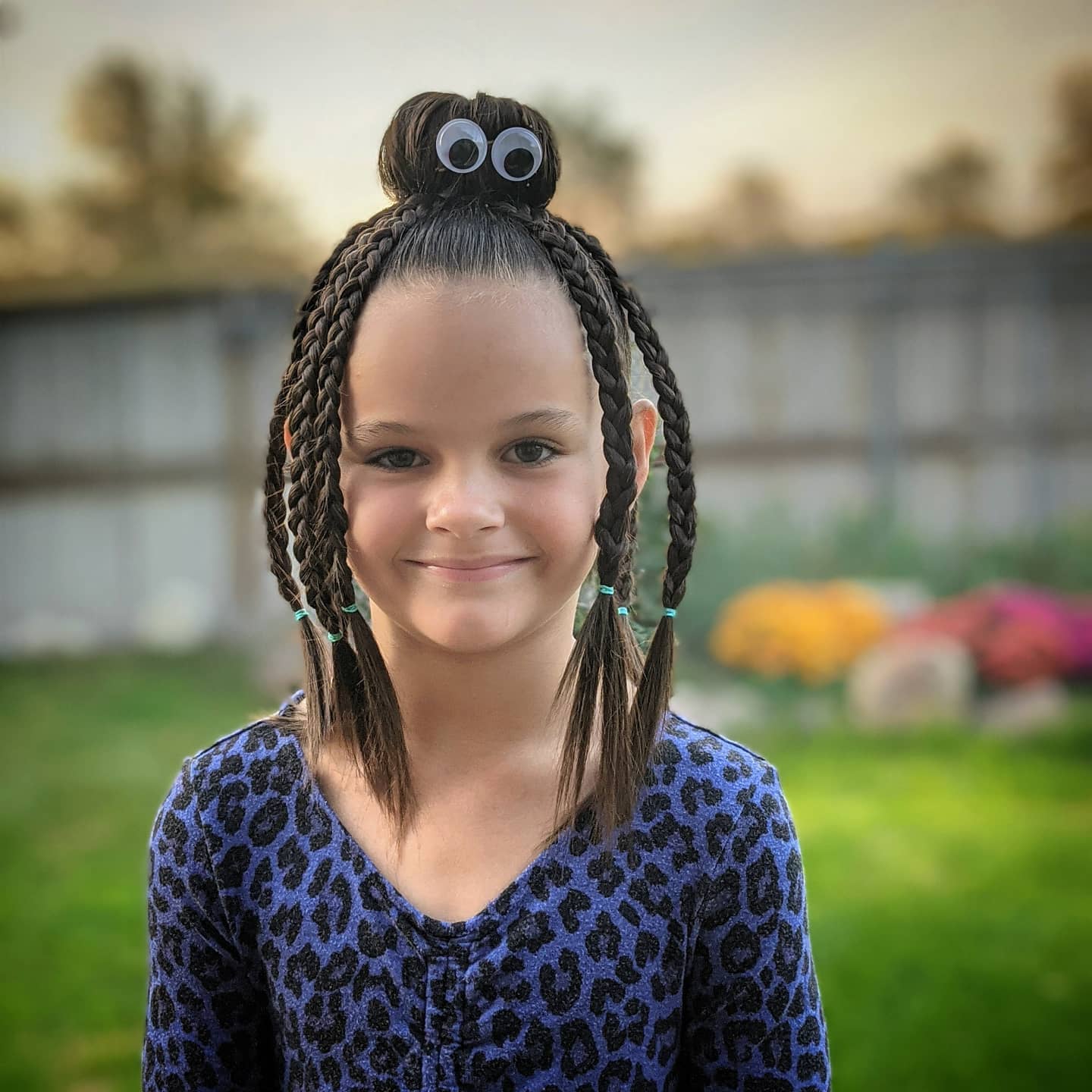 27 Spooktacular Halloween Hairstyles for Kids 2026 6 Spider-Inspired Braids With Googly Eye Accent