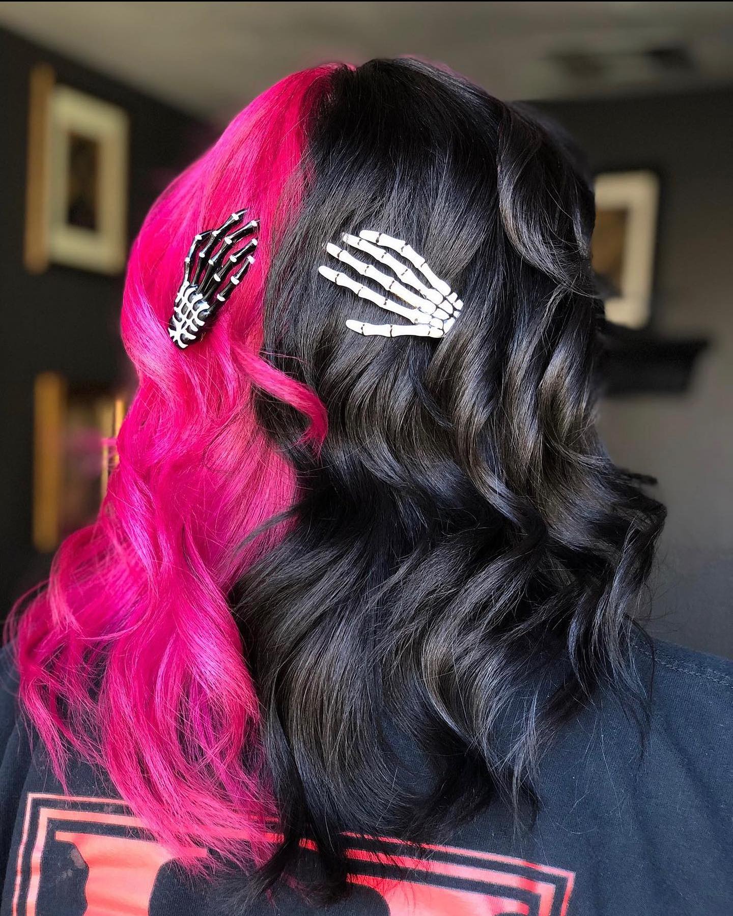 25 Spooktacular Halloween Hairstyles You Need to Try in 2026 11 Split Dye Hot Pink & Black With Skeleton Hand Clips
