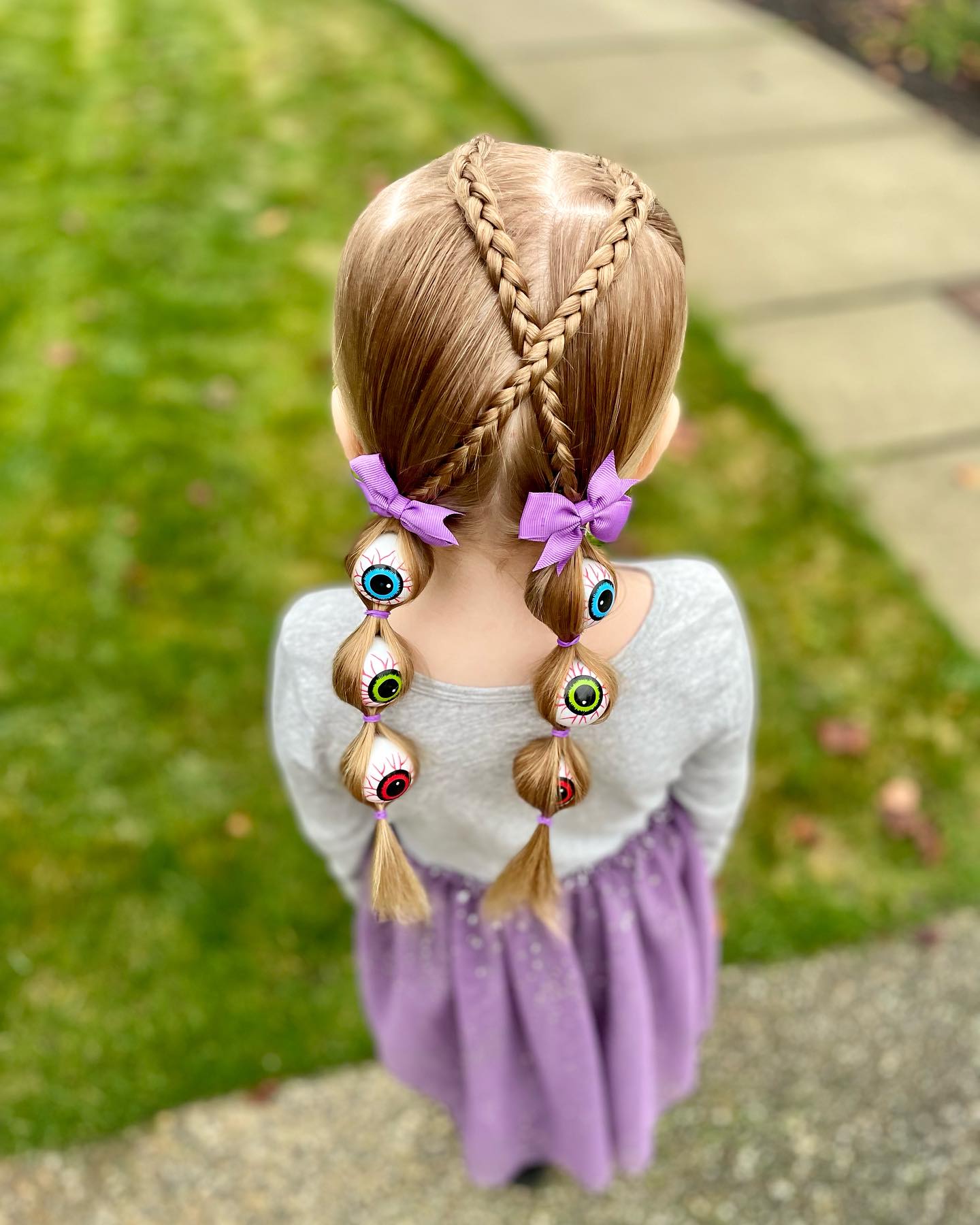 27 Spooktacular Halloween Hairstyles for Kids 2026 15 Spooky Eyeball Braids With French Heart Accent