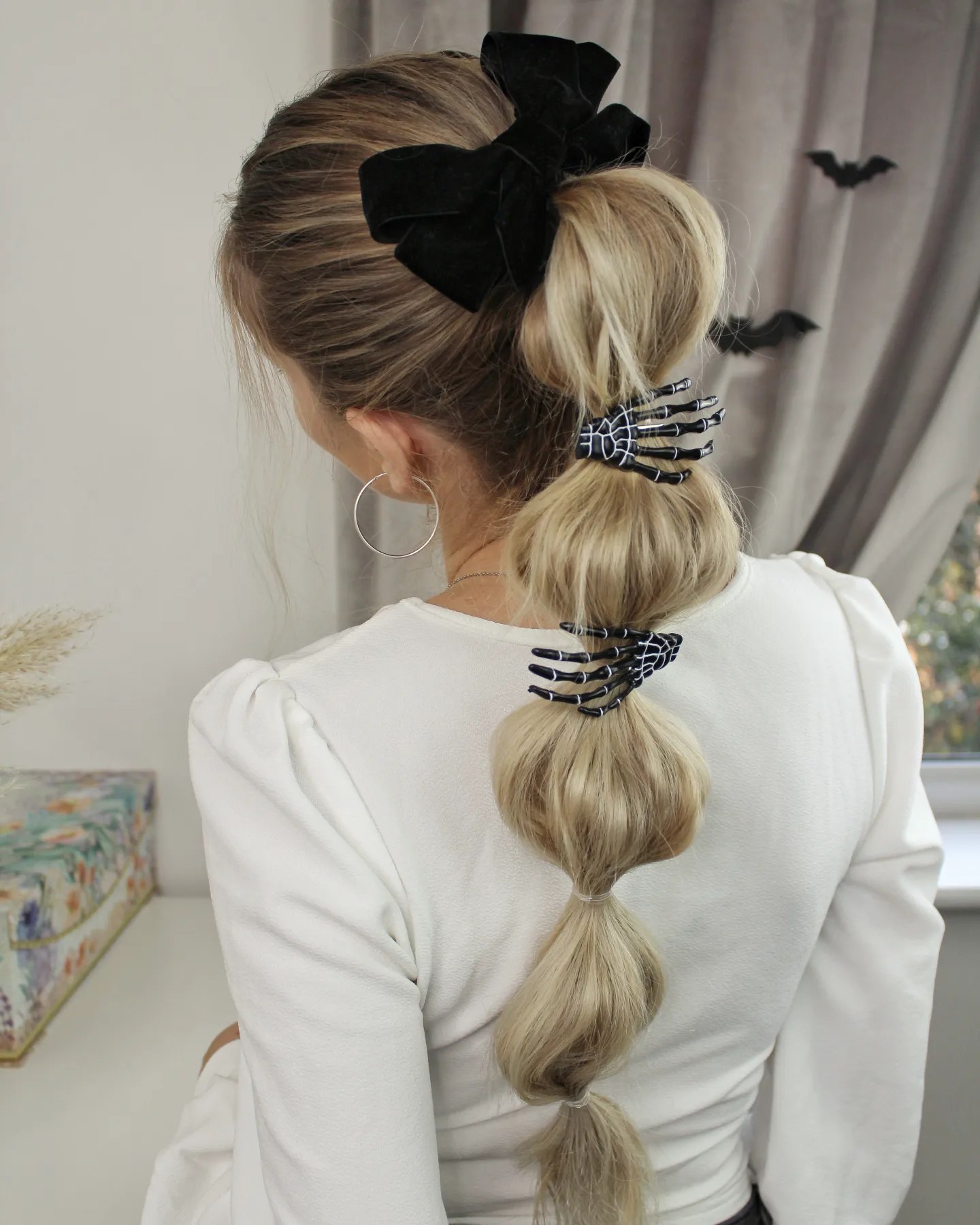 25 Spooktacular Halloween Hairstyles You Need to Try in 2026 15 Spooky Skeleton Claw Bubble Ponytail
