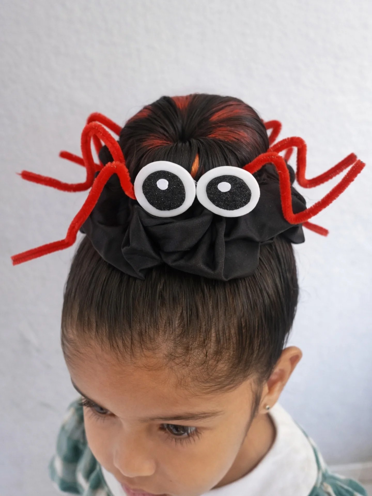 27 Spooktacular Halloween Hairstyles for Kids 2026 27 Spooky Spider Bun For Halloween Fun