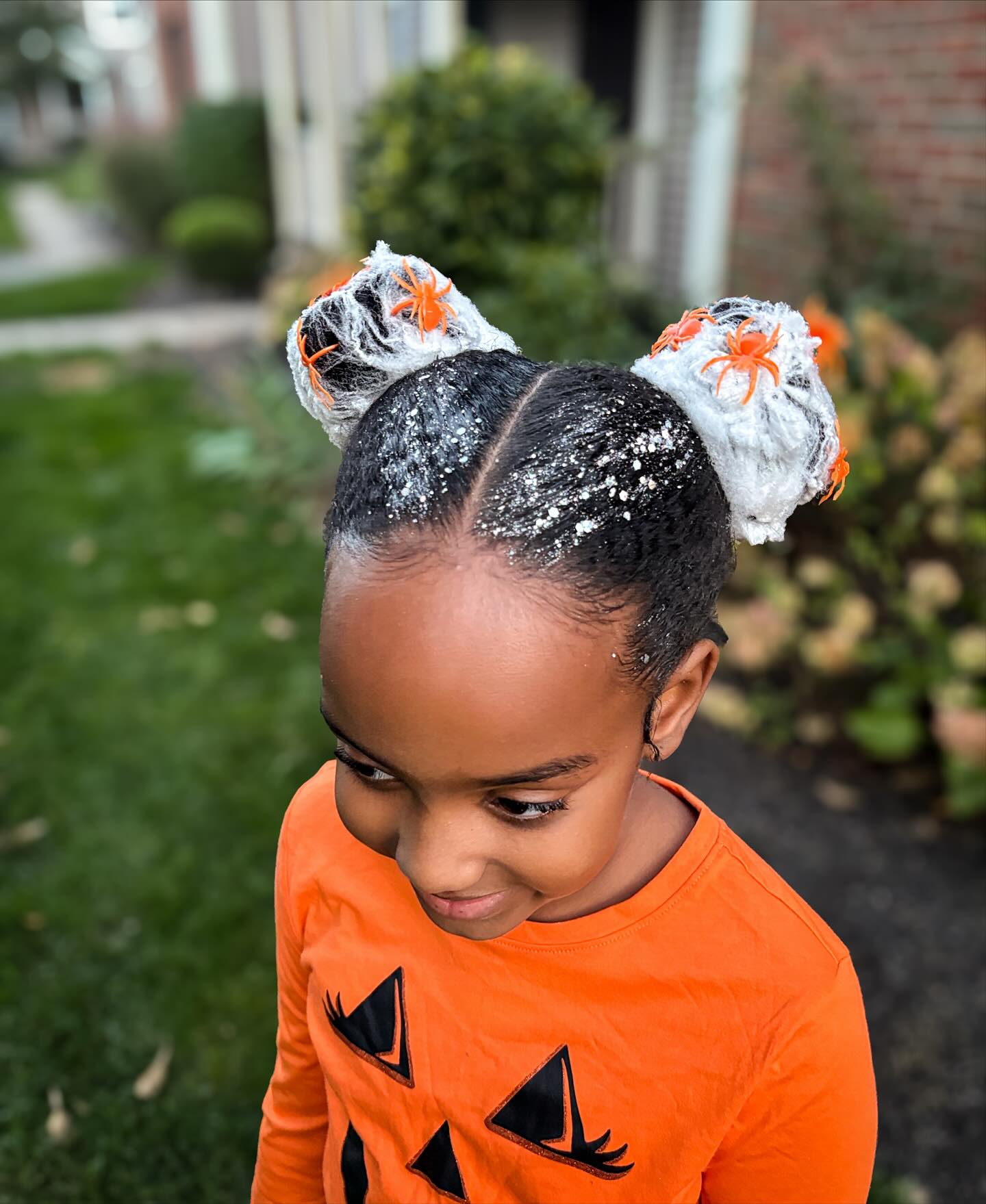 27 Spooktacular Halloween Hairstyles for Kids 2026 4 Spooky Spider Web Double Buns