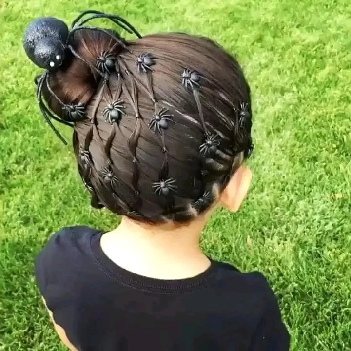 27 Spooktacular Halloween Hairstyles for Kids 2026 22 Spooky Spider Web Halloween Bun Hairstyle
