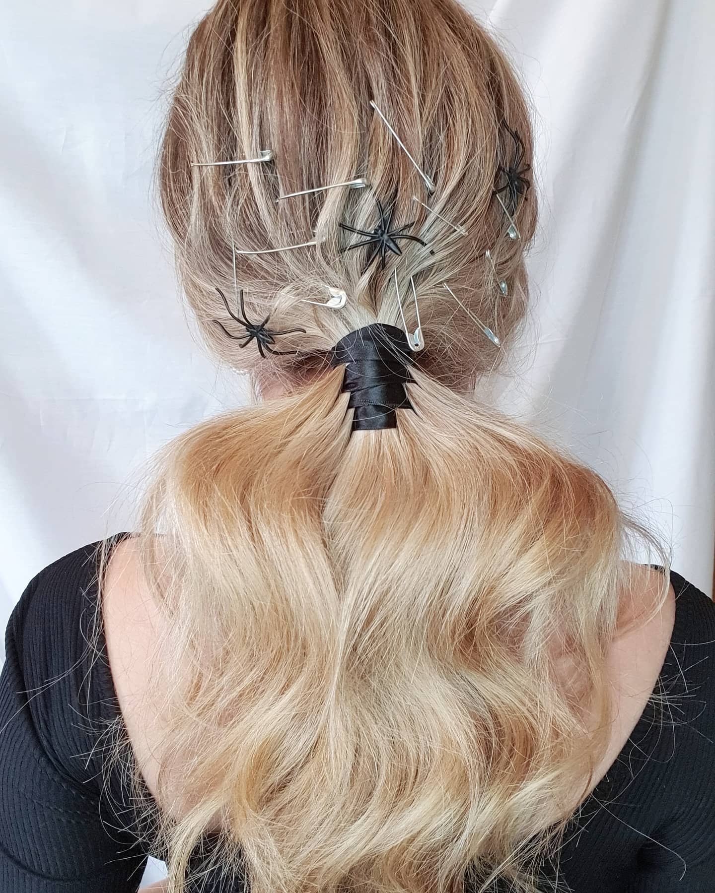 25 Spooktacular Halloween Hairstyles You Need to Try in 2026 16 Spooky Spider Web Ponytail Halloween Hairstyle
