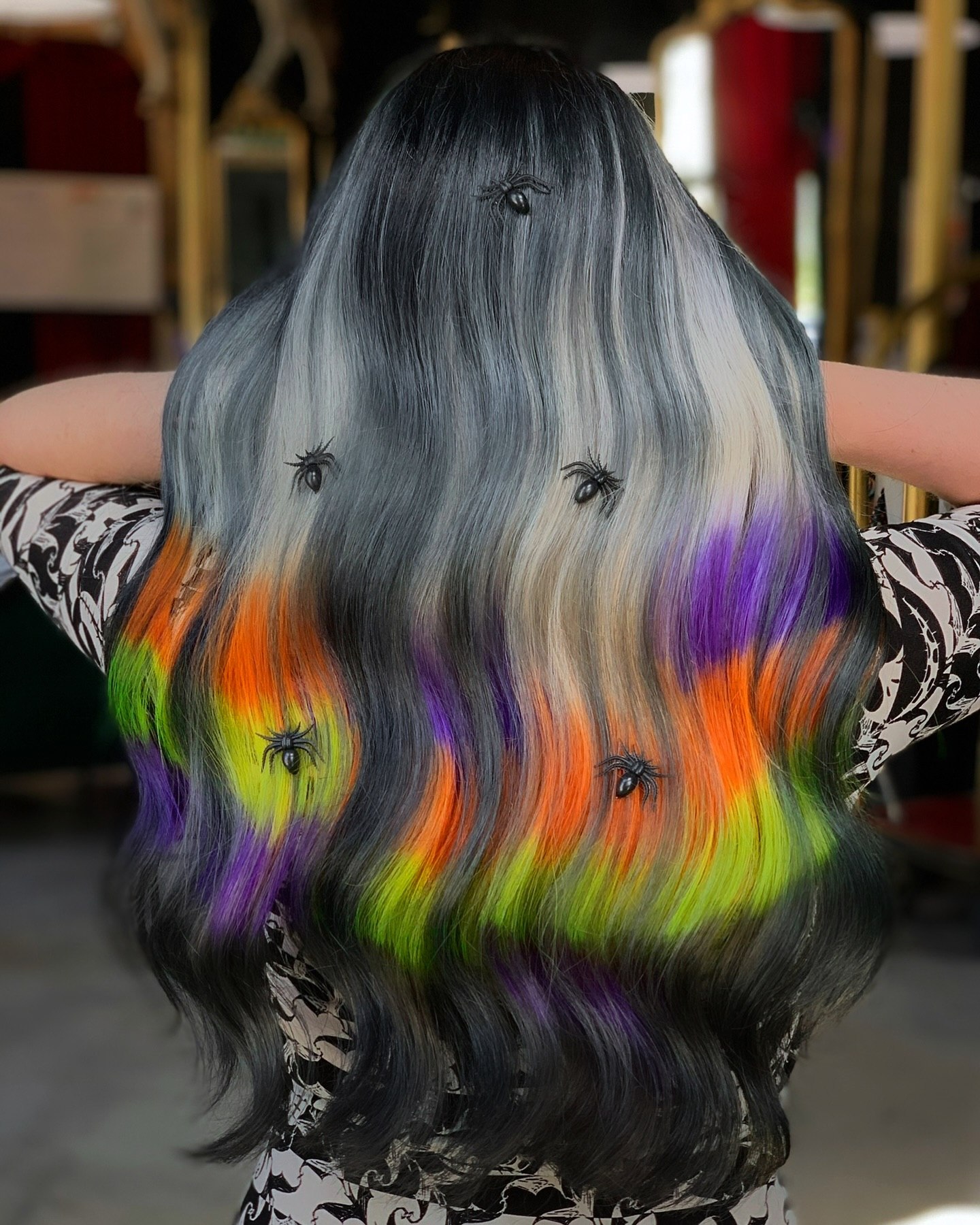 25 Spooktacular Halloween Hairstyles You Need to Try in 2026 6 Spooky Spiderweb Halloween Hair with Neon Streaks