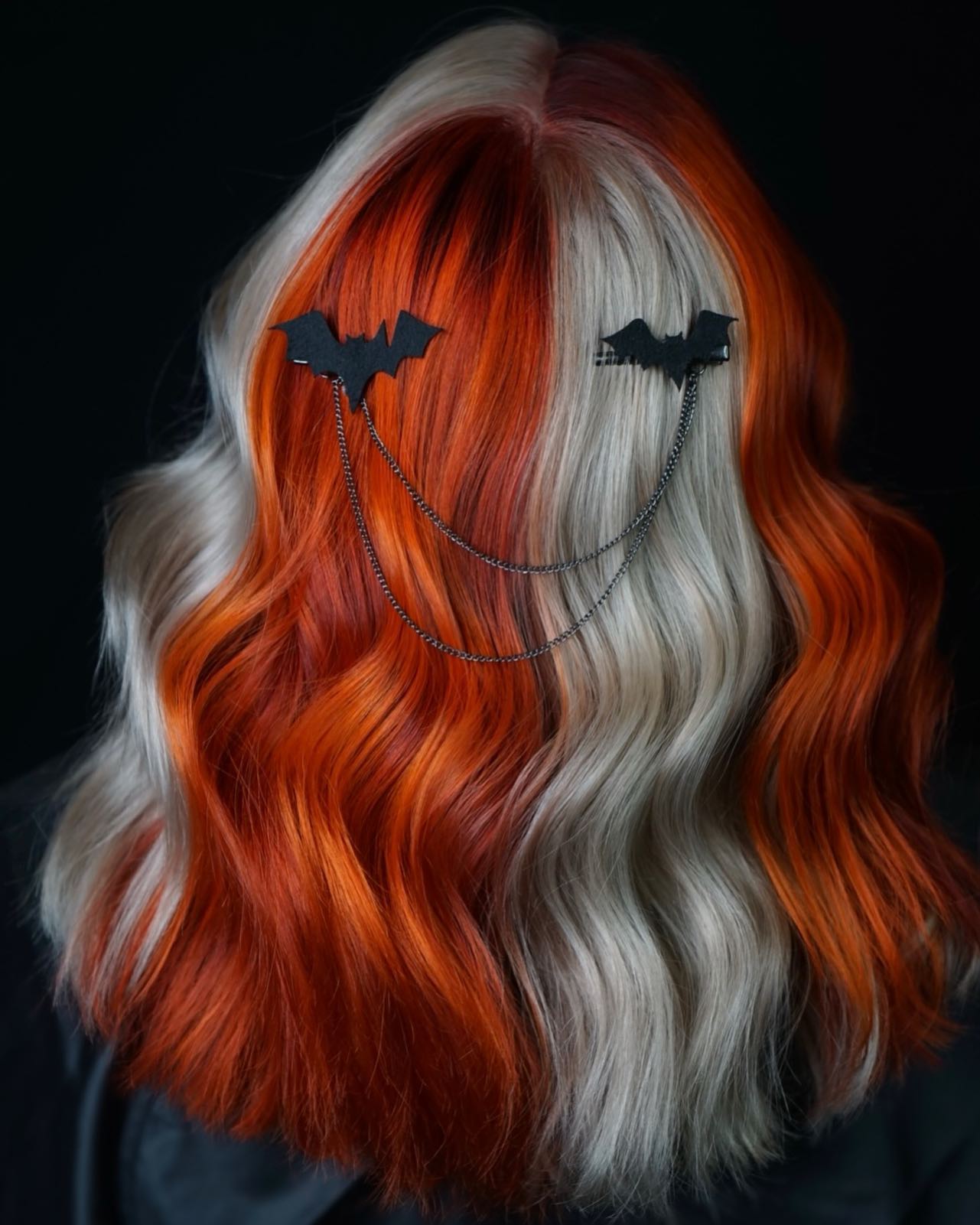 25 Spooktacular Halloween Hairstyles You Need to Try in 2026 22 Spooky Split Dye With Bat Charm Hair Clips