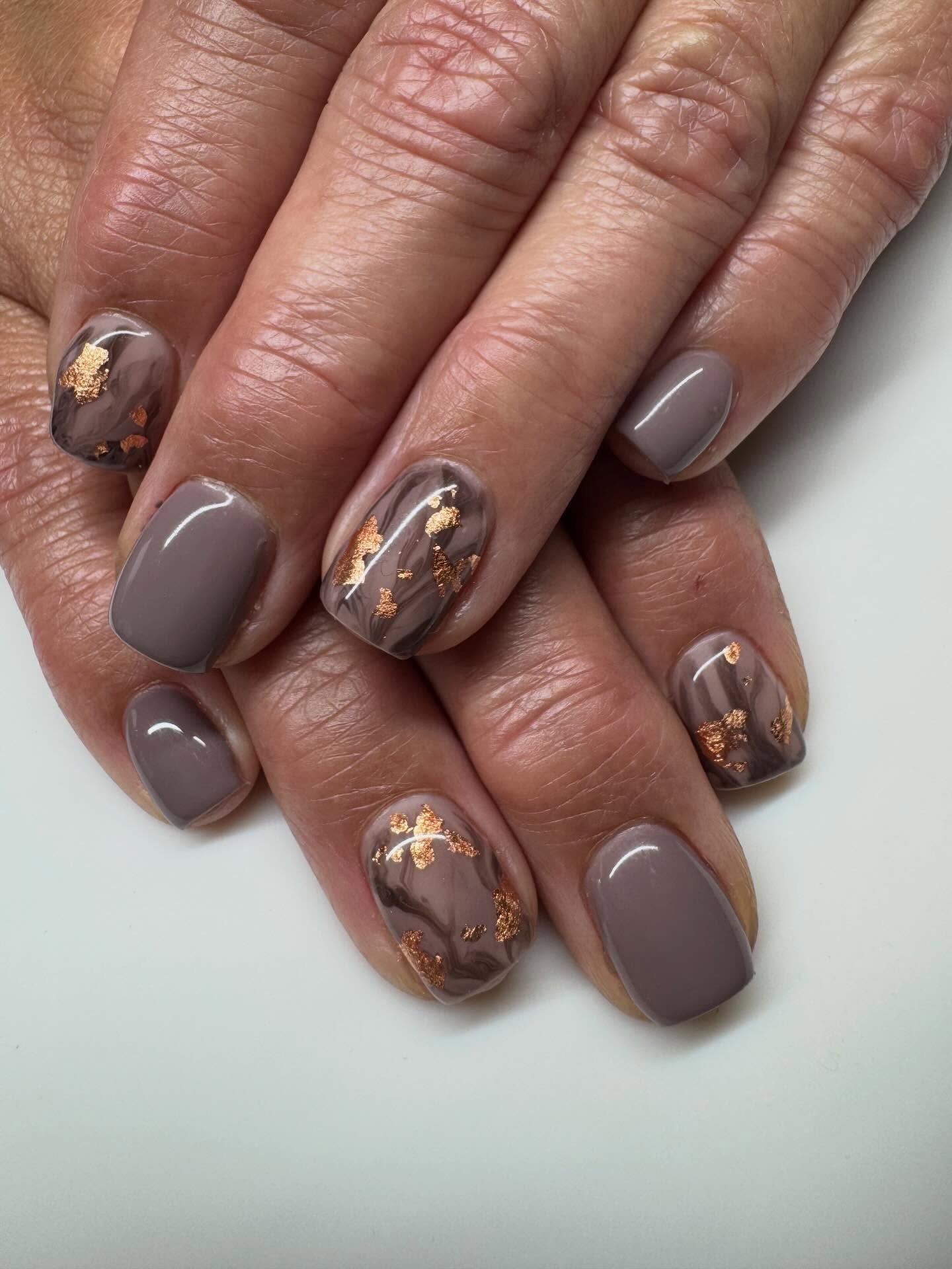 25 Fall Nail Ideas You Need to Try in 2026 25 Taupe Marble Swirls with Gold Foil Accents
