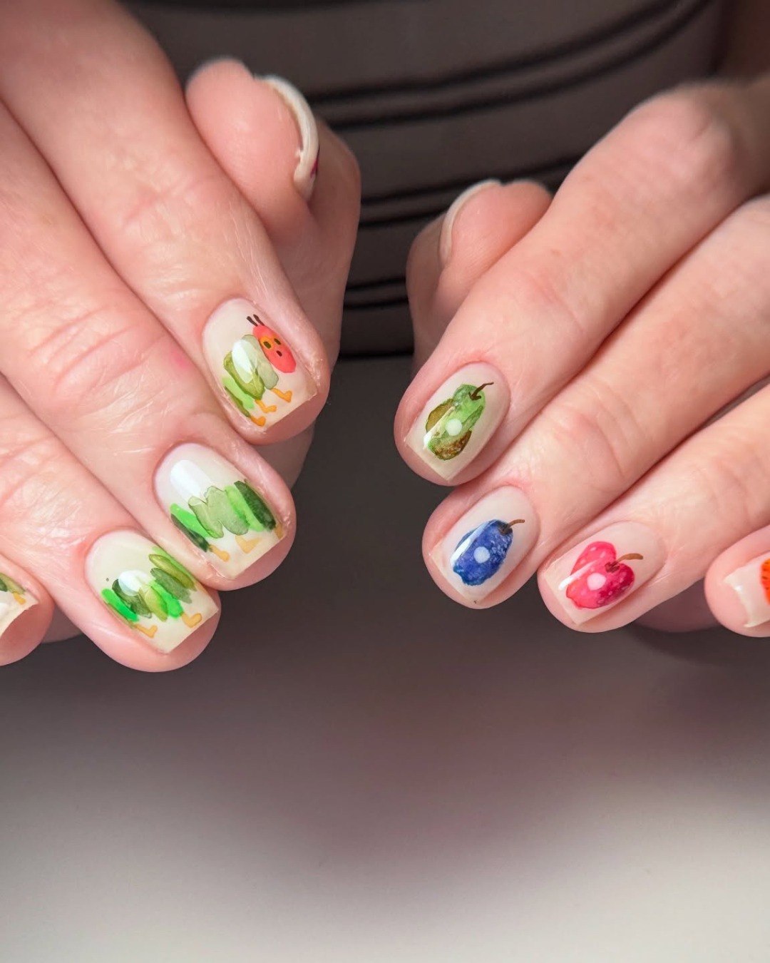 25 Back to School Nail Ideas for 2026 22 The Very Hungry Caterpillar Fruit Nail Art