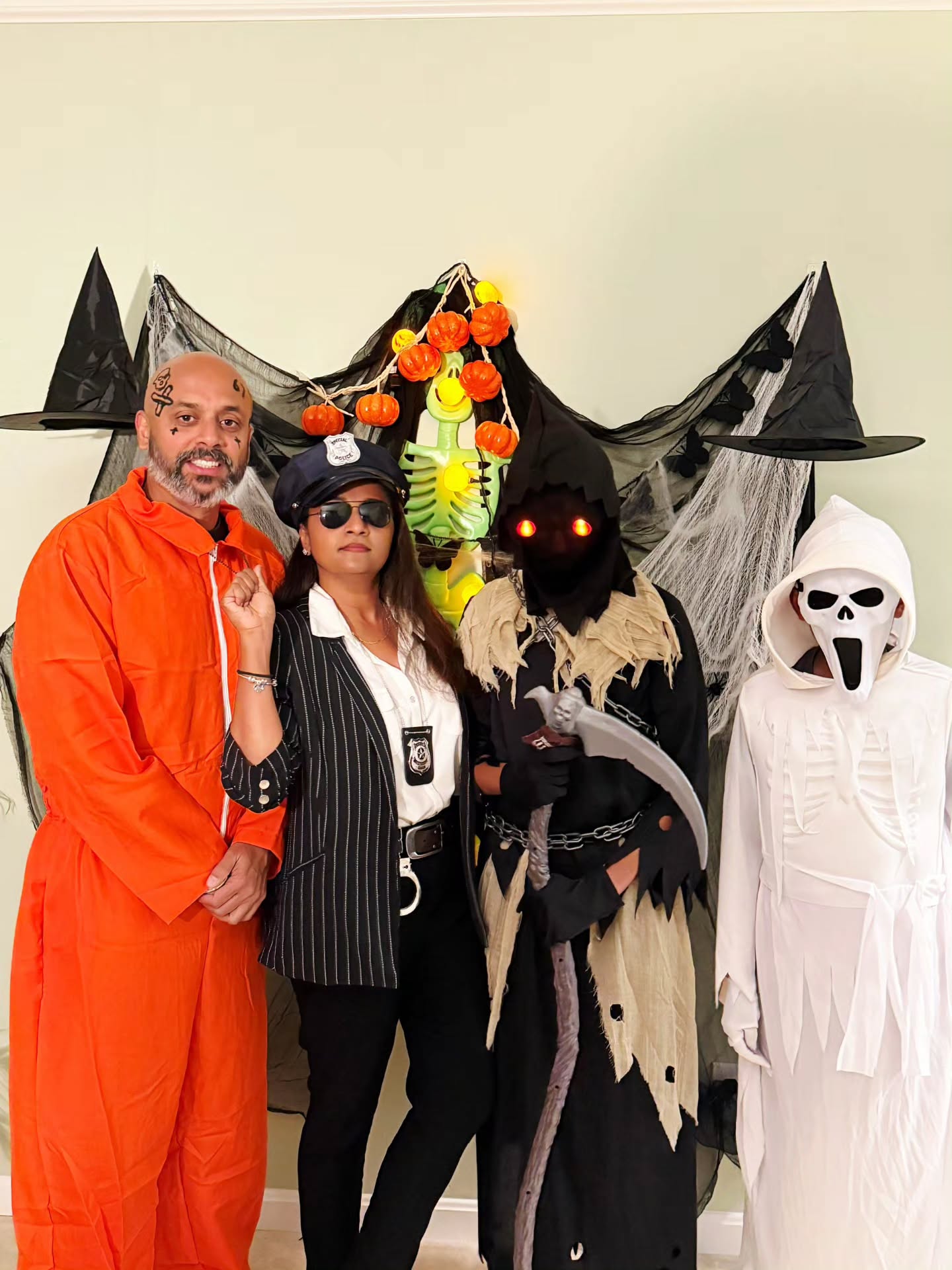 Trio Halloween Costumes: Prisoner, Cop, And Grim Reaper