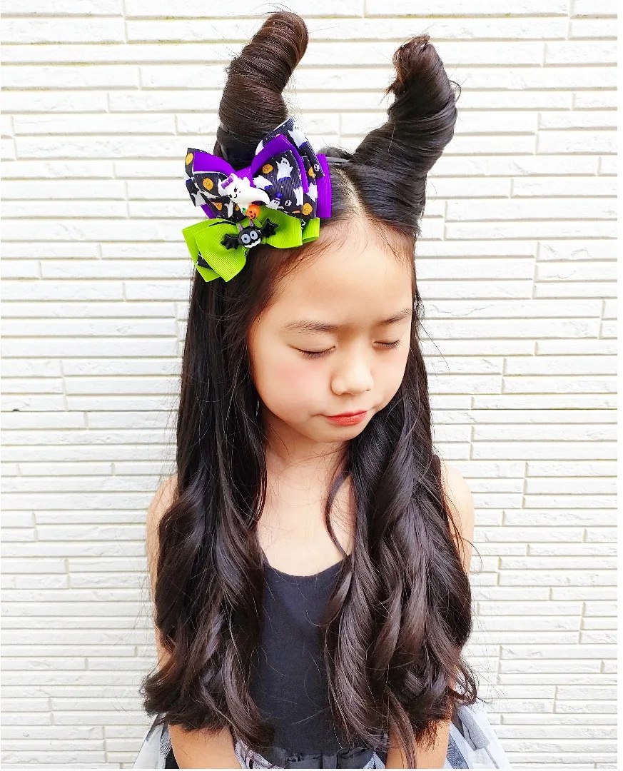 27 Spooktacular Halloween Hairstyles for Kids 2026 20 Twisted Devil Horns With Halloween Bow