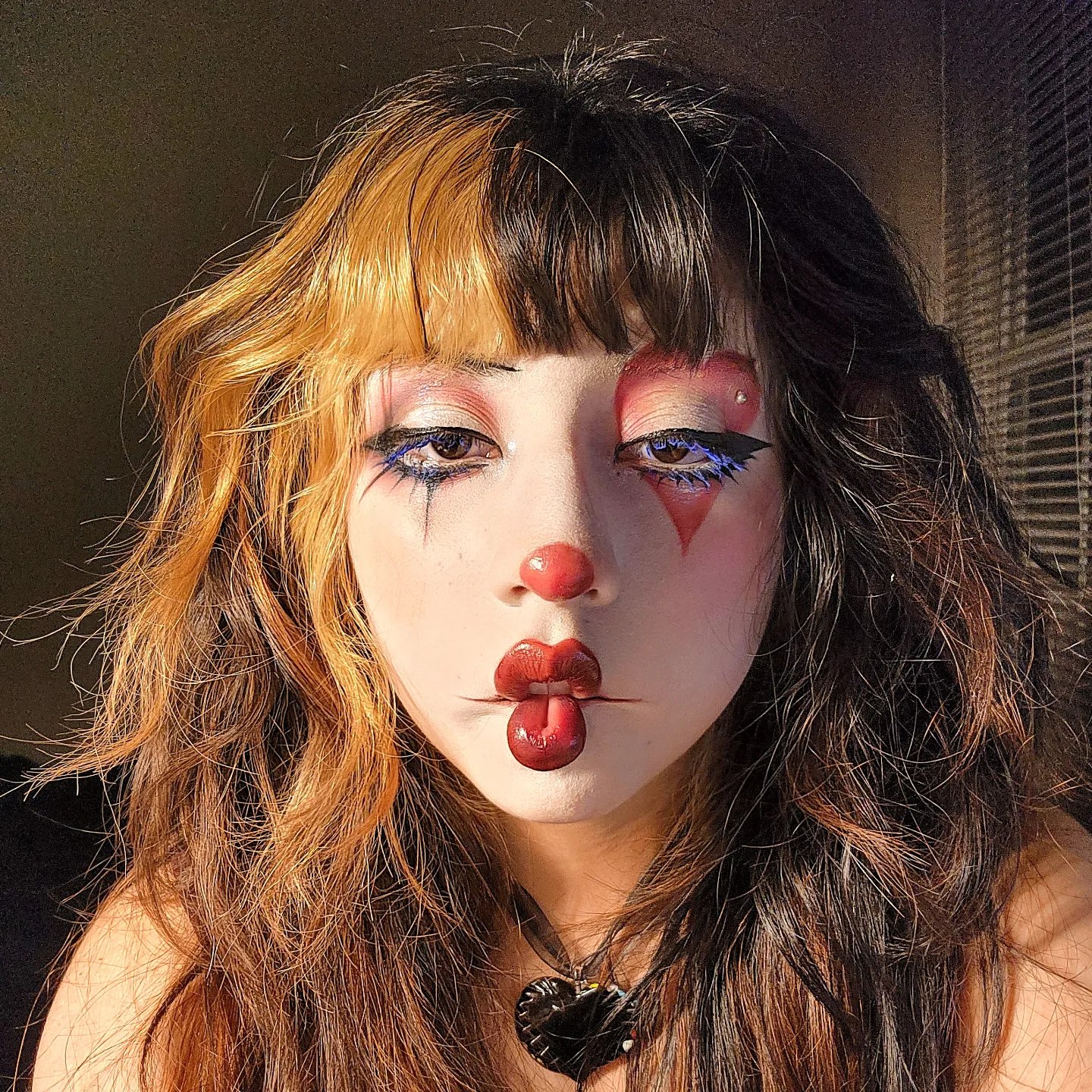 25 Wild Clown Hairstyles for 2026 You Need to See 19 Two-Tone Clown Hair With Wispy Bangs