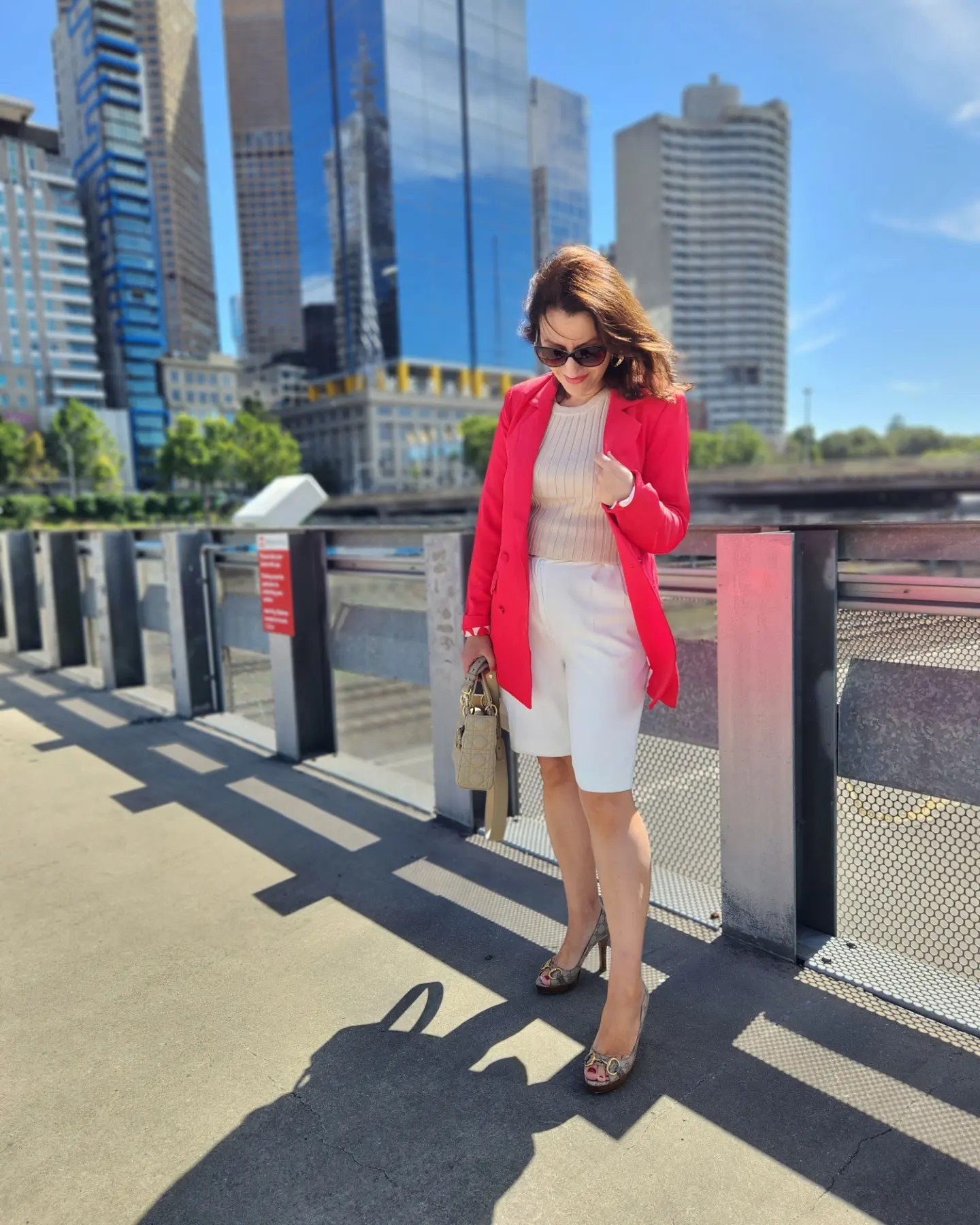 Vibrant Blazer With White Bermudas And Snakeskin Heels
