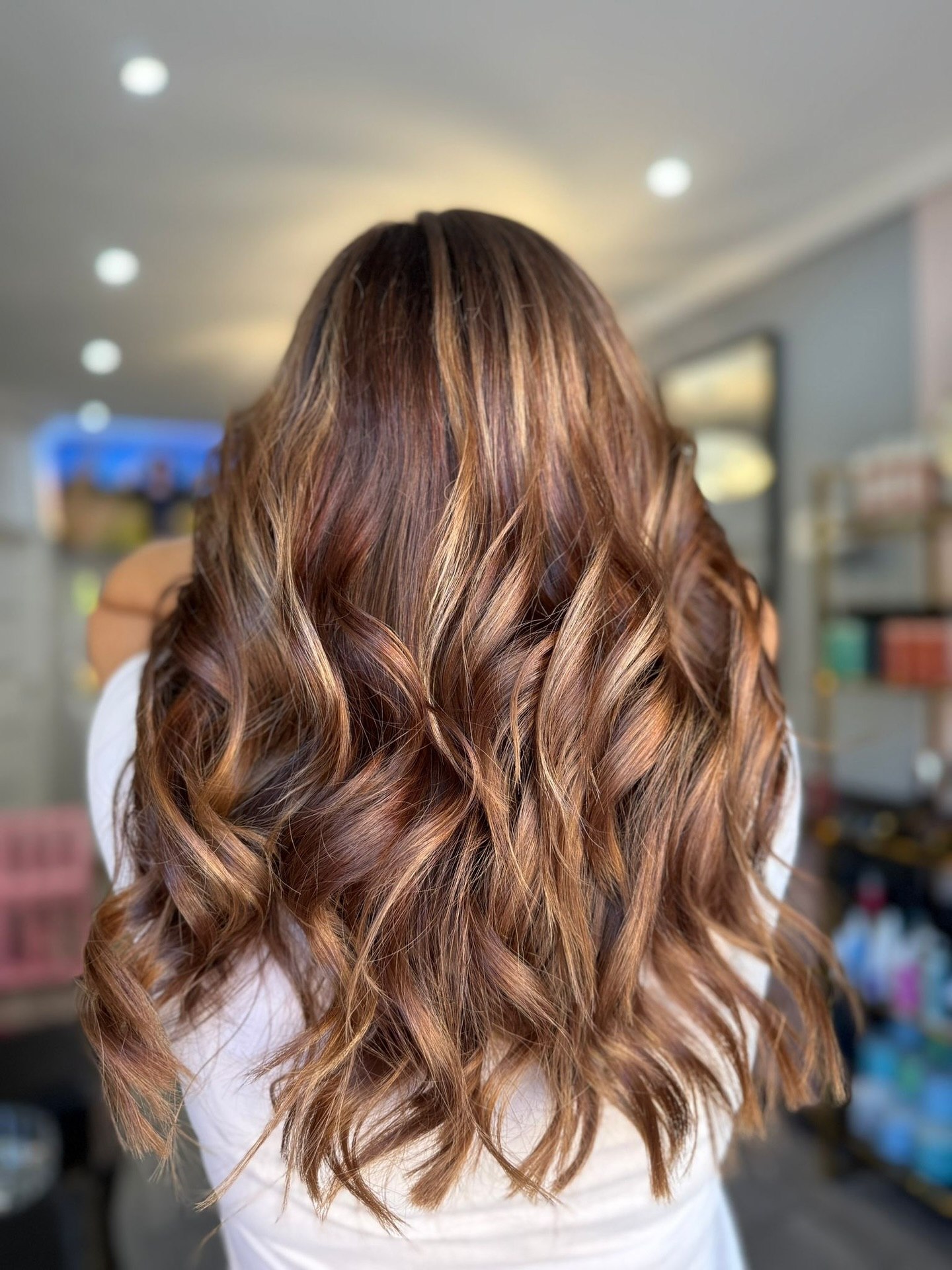 27 Stunning Fall Hairstyles You Need To Try In 2026 24 Warm Auburn Balayage With Sunkissed Medium Waves