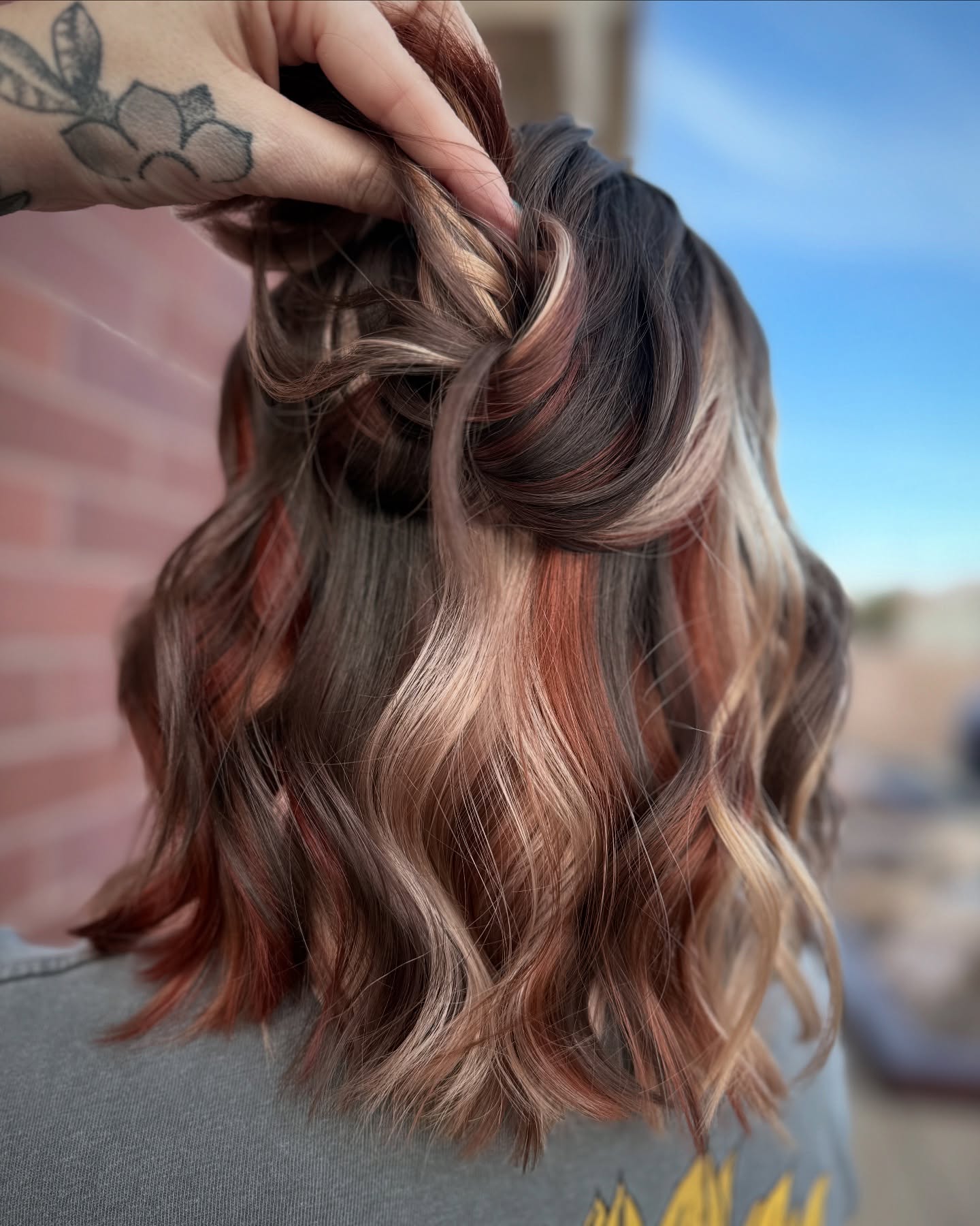 29 Calico Hair Color Styles You Need to See for 2026 18 Wavy Calico Hair With Casual Half-Up Twist