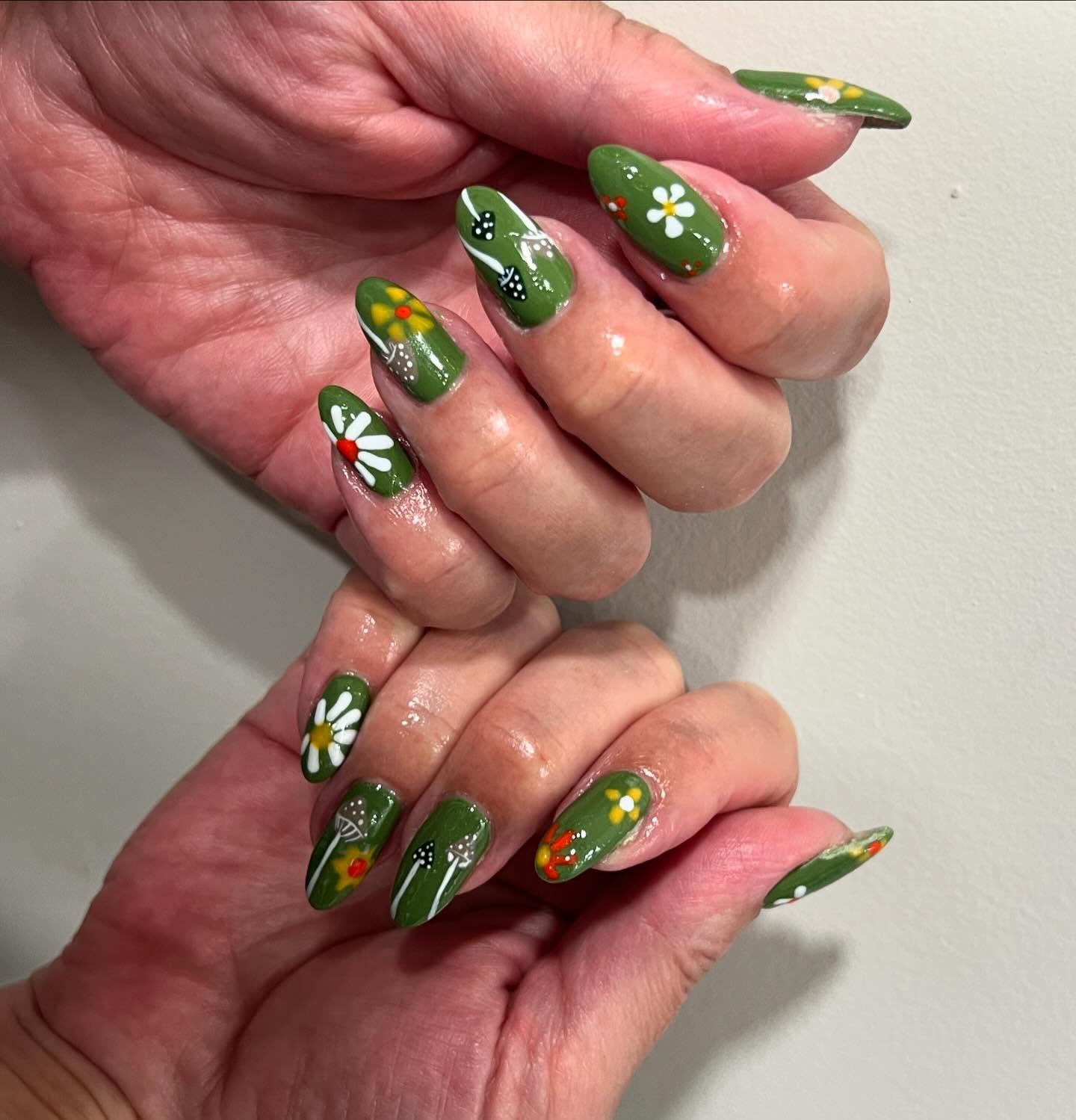 27 End of Summer Nail Ideas for 2026 9 Whimsical Garden Green Almond Nails with Daisy Art