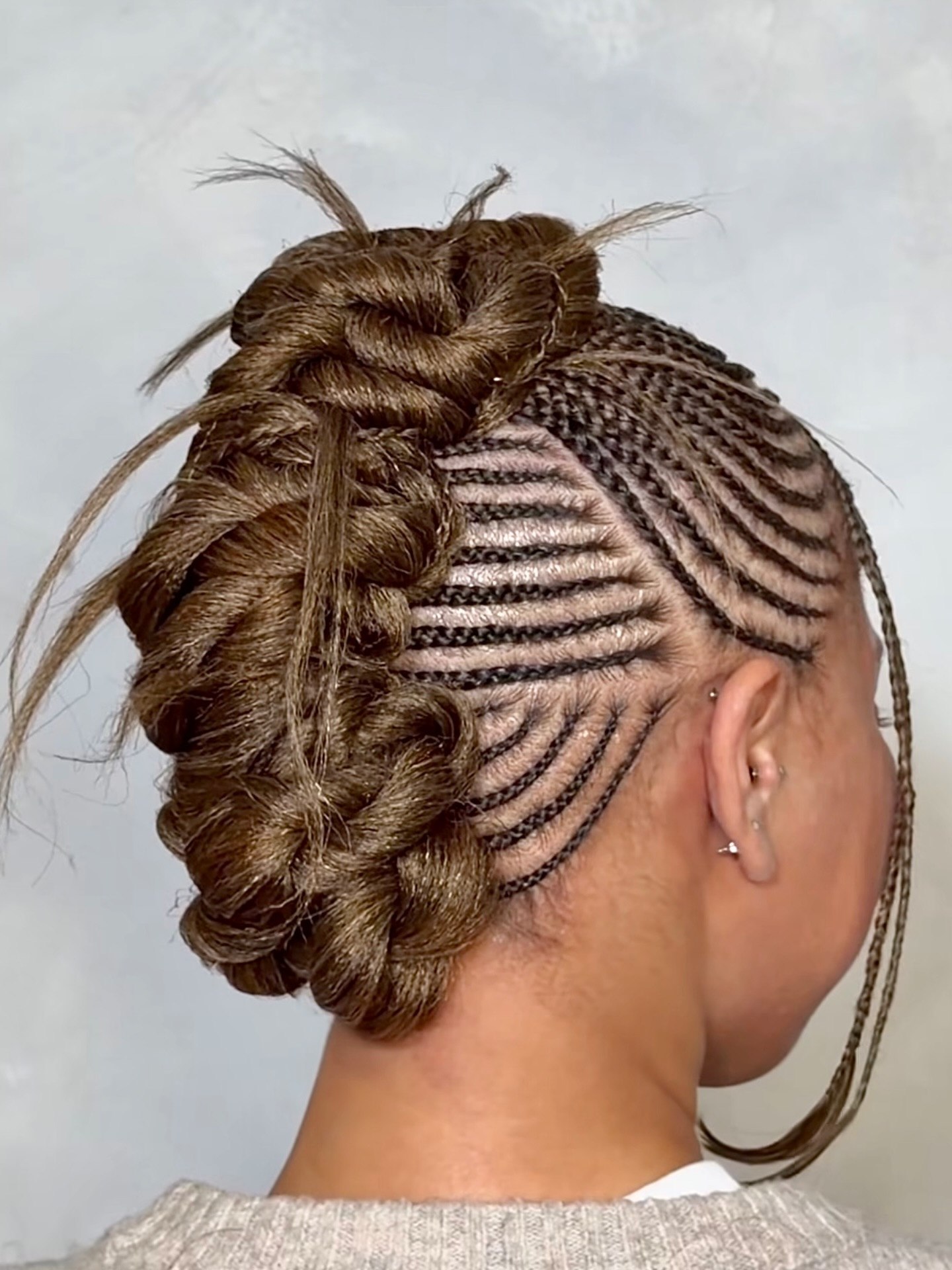 Artistic Cornrow Updo With Braided Accent