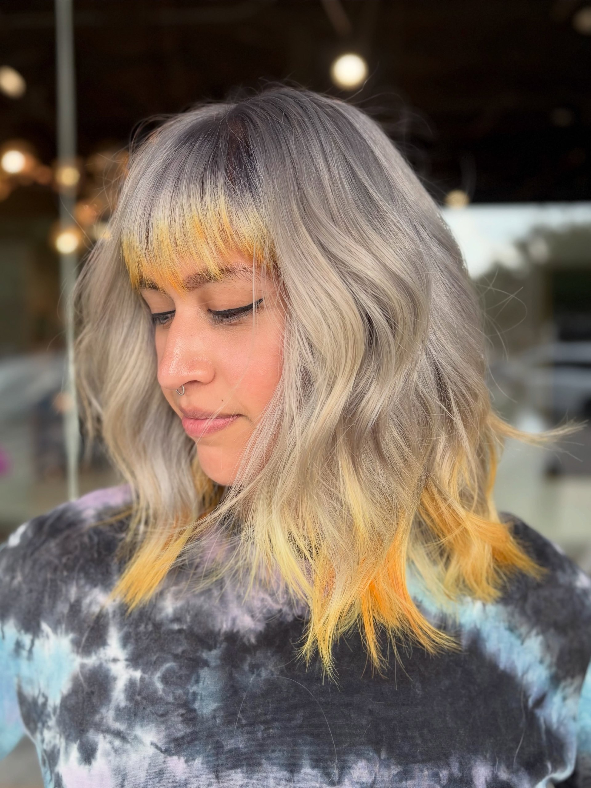 Ash Blonde Waves With Fiery Orange Underlights
