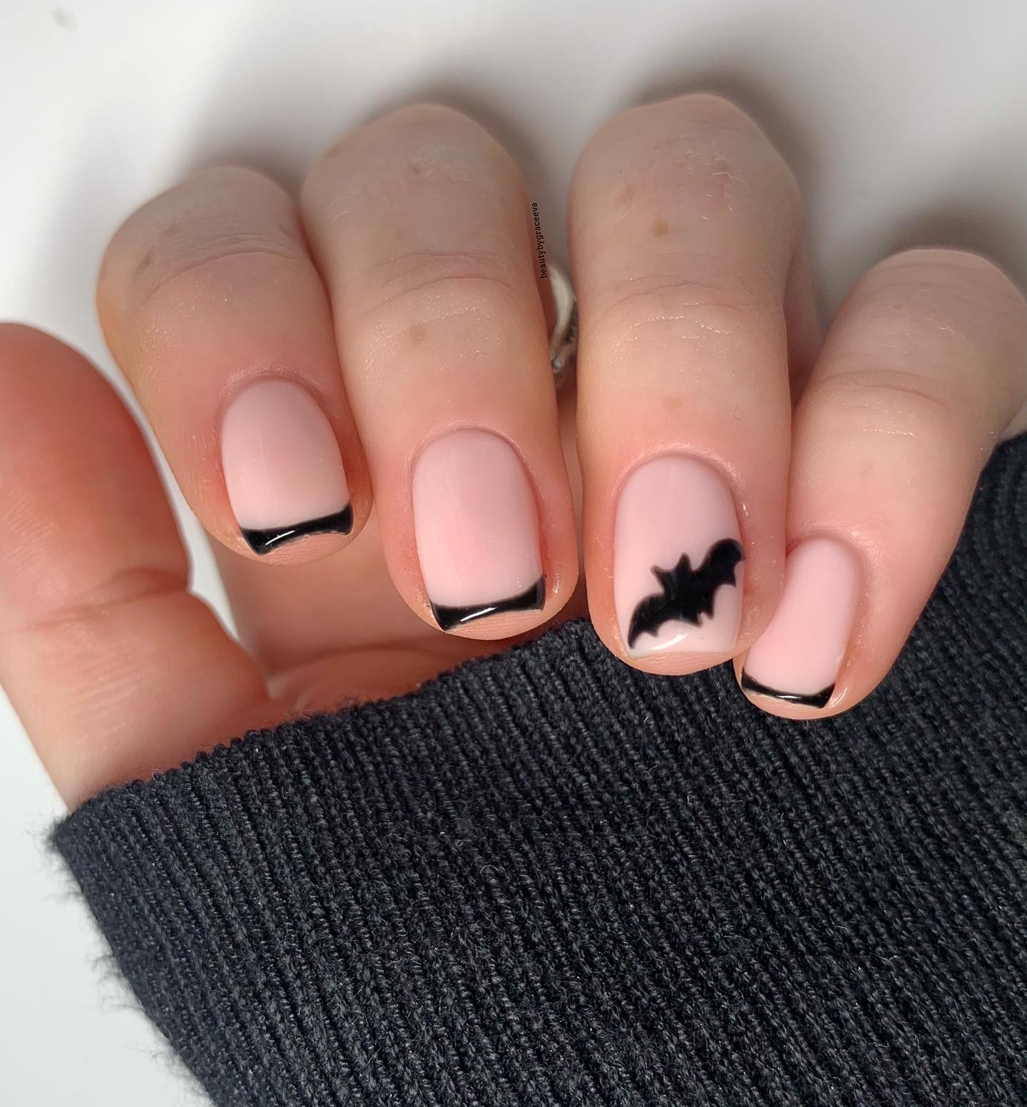 Blush French Tips with a Bat Accent
