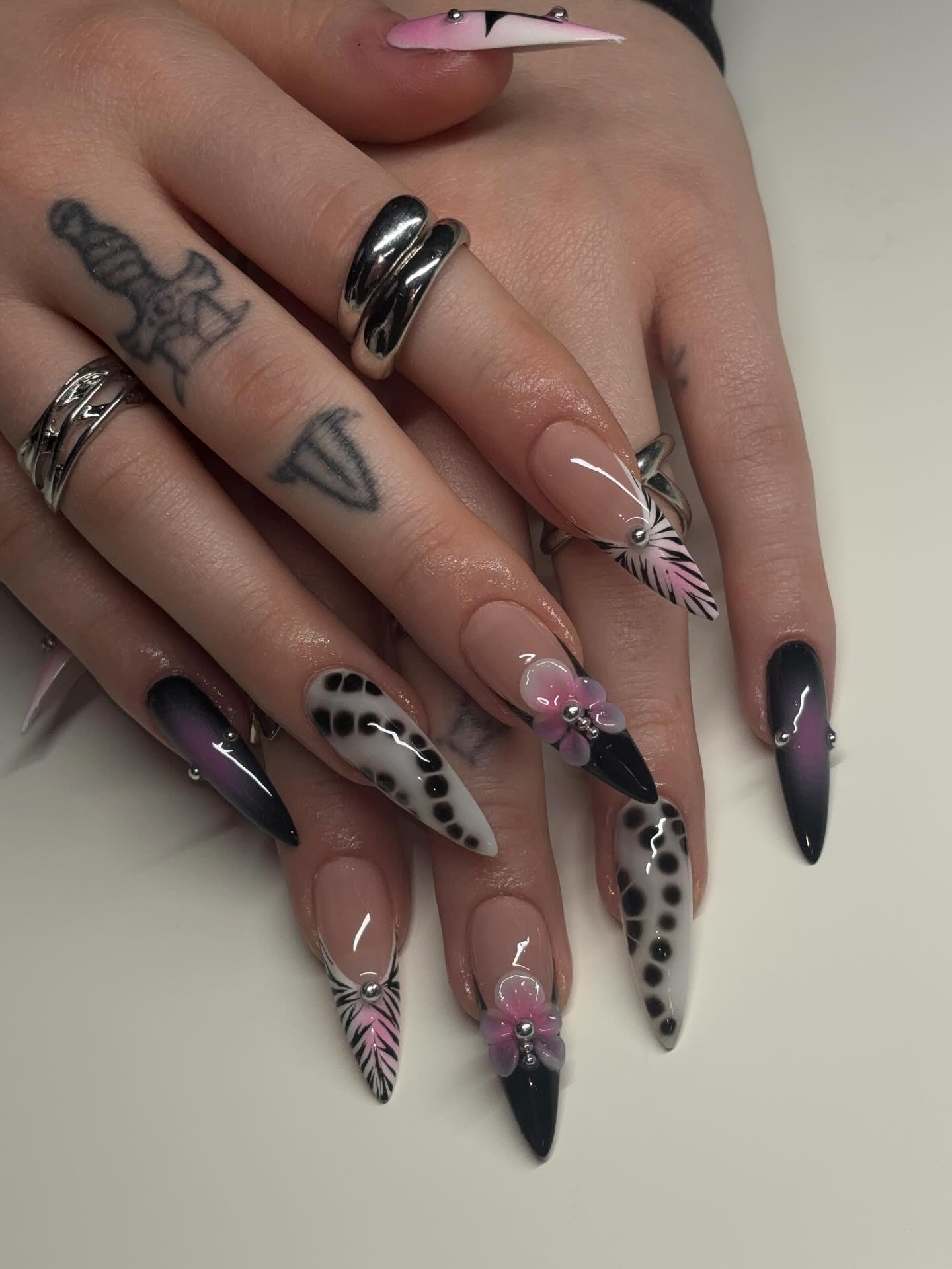 Bold Abstract Stiletto Nails with 3D Accents