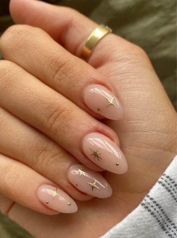 Celestial Nude Almond Nails with Gold Star Accents