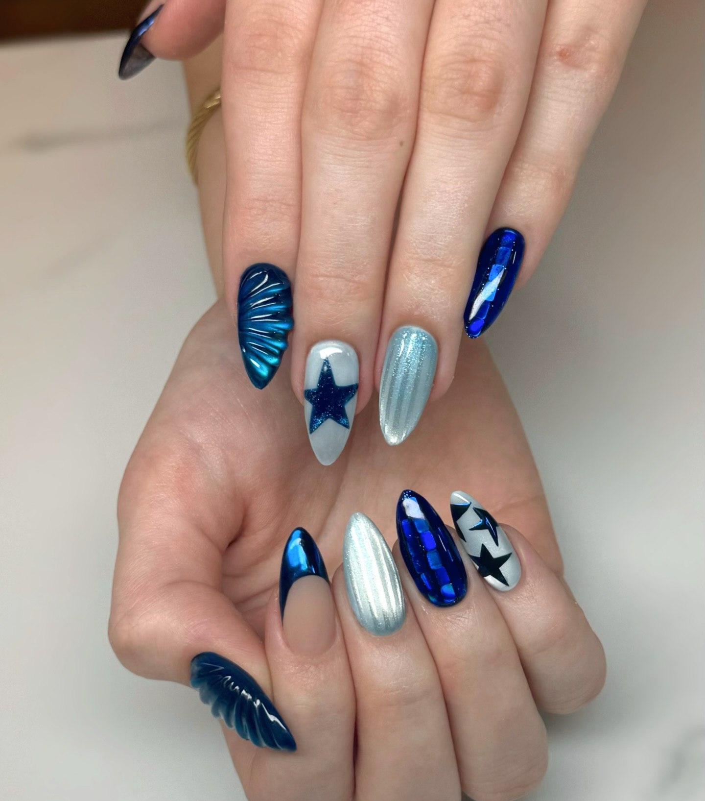 Deep Blue Chrome Stiletto Star Nails